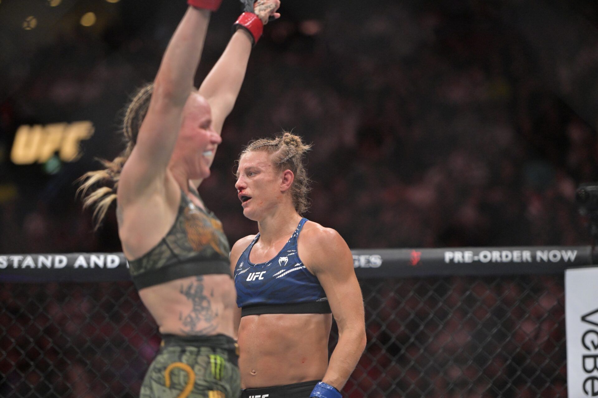 Valentina Shevchenko (red gloves) reacts after defeating Manon Fiorot (blue gloves) during UFC 315 at Bell Centre.