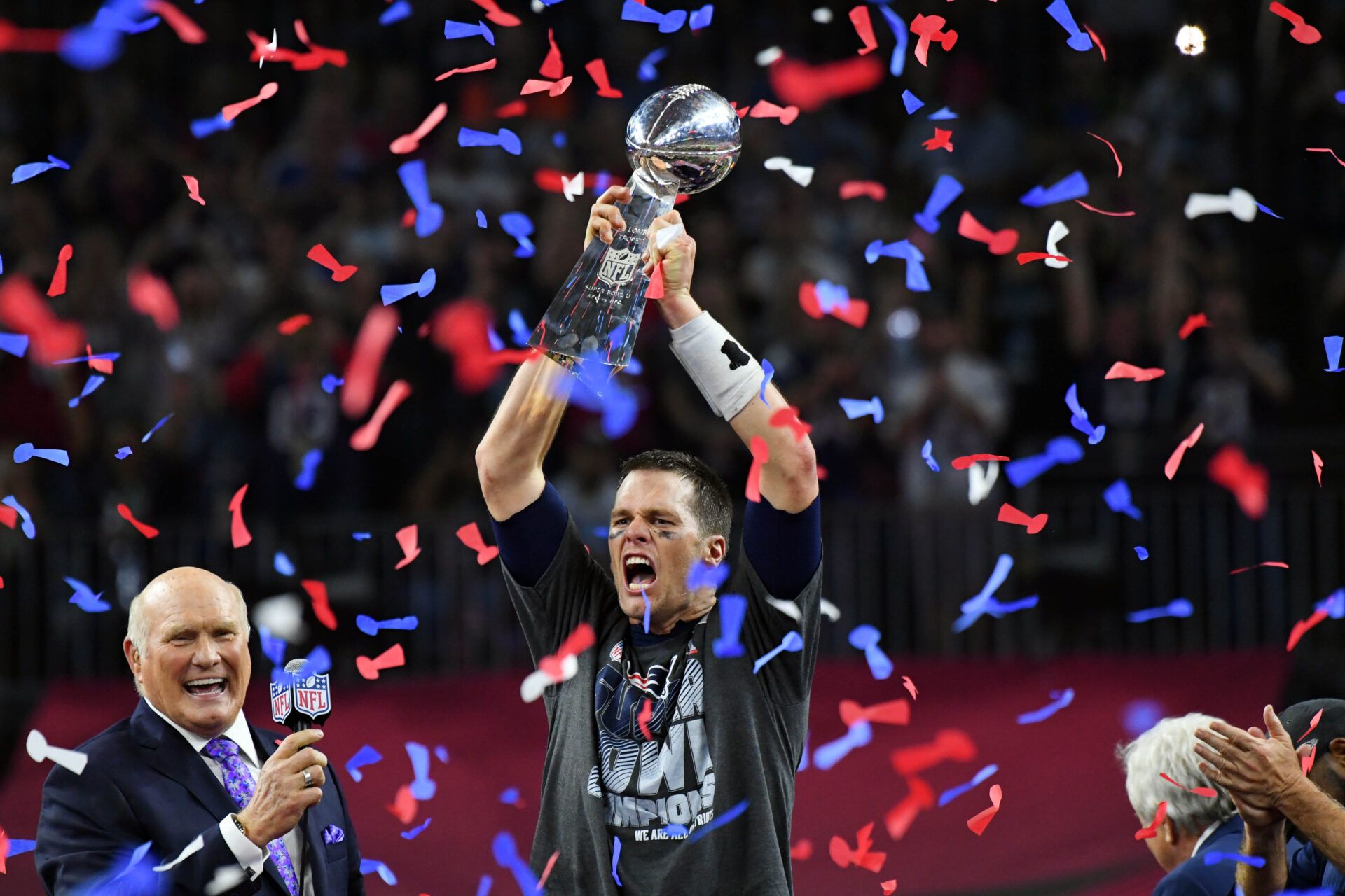 New England Patriots quarterback Tom Brady celebrates with the Vince Lombardi Trophy after defeating the Atlanta Falcons 34-38 in Super Bowl LI at NRG Stadium.