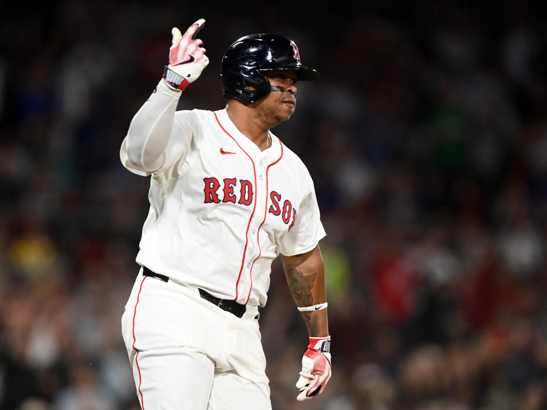 BOSTON, MASSACHUSETTS - MAY 02: Rafael Devers #11 of the Boston Red Sox reacts after hitting a two-run RBI against the Minnesota Twins during the seventh inning at Fenway Park on May 02, 2025 in Boston, Massachusetts. (Photo by Brian Fluharty/Getty Images)