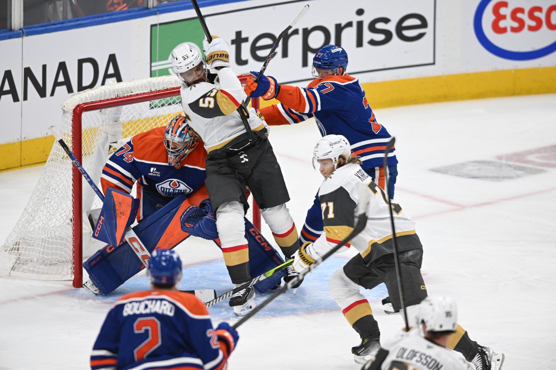 Edmonton Oilers goalie Stuart Skinner (74) looks for the puck while Vegas Golden Knights right winger Keegan Kolesar (55) and Oilers defenceman Brett Kulak (27) battle during the third period in game three of the second round of the 2025 Stanley Cup Playoffs at Rogers Place.