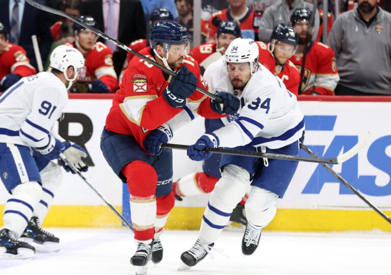 Florida Panthers center Sam Reinhart (13) and Toronto Maple Leafs center Auston Matthews (34) skate during the second period in game four of the second round of the 2025 Stanley Cup Playoffs at Amerant Bank Arena.