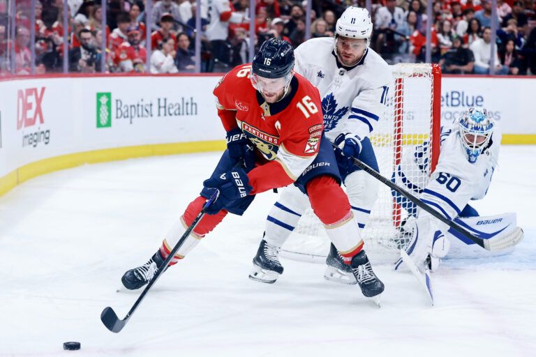 SUNRISE, FLORIDA - MAY 11: Aleksander Barkov #16 of the Florida Panthers and Max Domi #11 of the Toronto Maple Leafs fight for possession of the puck during the second period in Game Four of the Second Round of the 2025 Stanley Cup Playoffs at Amerant Bank Arena on May 11, 2025 in Sunrise, Florida. (Photo by Carmen Mandato/Getty Images)