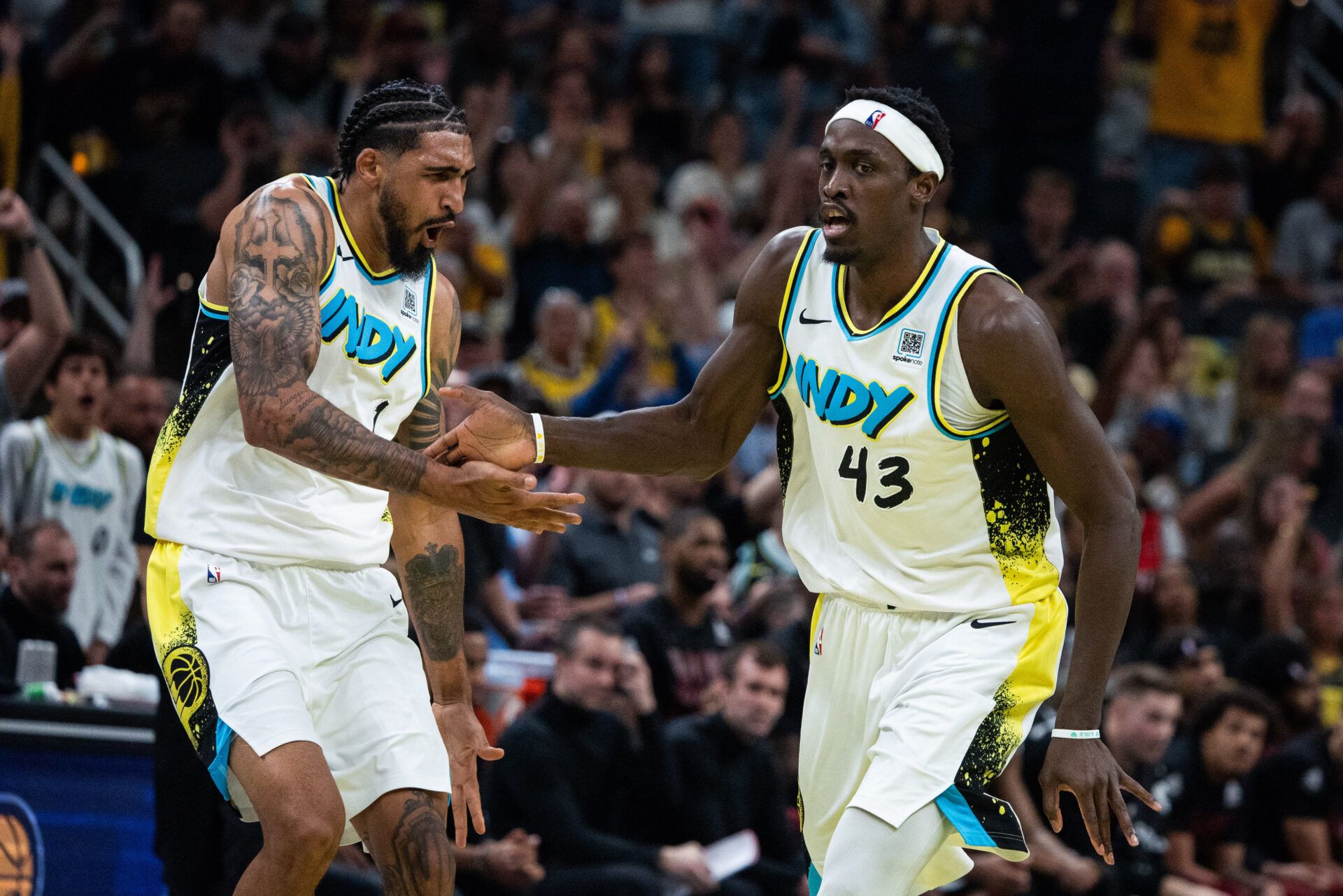 Indiana Pacers forward Pascal Siakam (43) and forward Obi Toppin (1) celebrate a made basket during game four of the second round for the 2025 NBA Playoffs against the Cleveland Cavaliers at Gainbridge Fieldhouse.