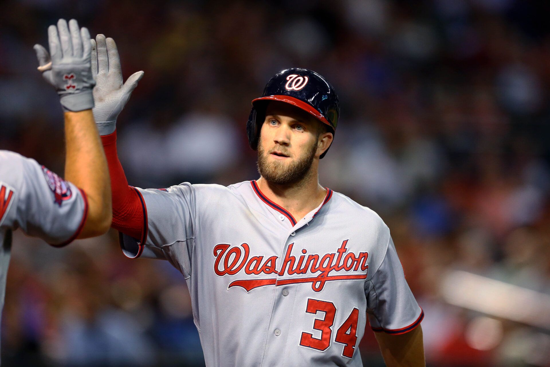 Washington Nationals outfielder Bryce Harper celebrates with teammates after hitting a solo home run in sixth inning against the Arizona Diamondbacks at Chase Field.