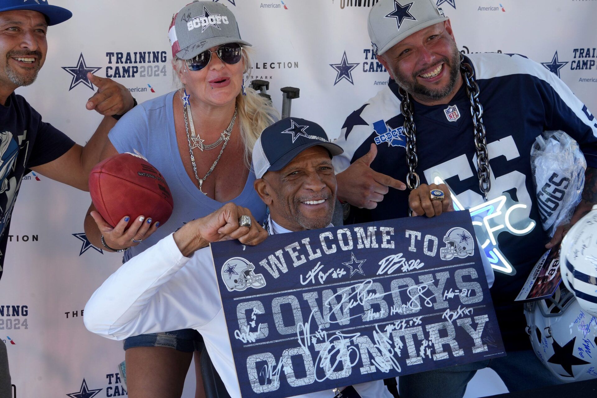 Drew Pearson, a former wide receiver for the Dallas Cowboys, signs autographs and poses for photos during Cowboys Fan Night at the Collection in Oxnard on Friday, July 26, 2024. The event celebrates the team's annual return to Oxnard for training camp. © JUAN CARLO/THE STAR / USA TODAY NETWORK