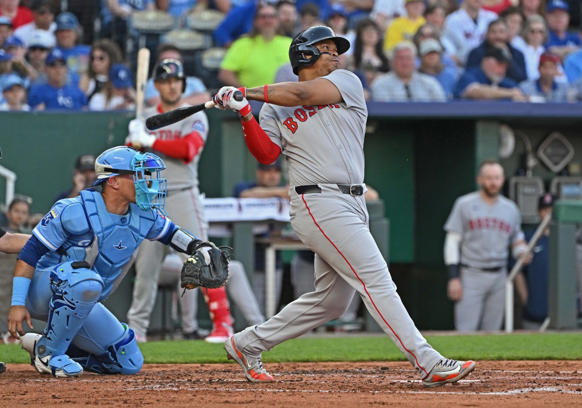 Boston Red Sox designated hitter Rafael Devers (11) hits an RBI double in the third inning against the Kansas City Royals at Kauffman Stadium.