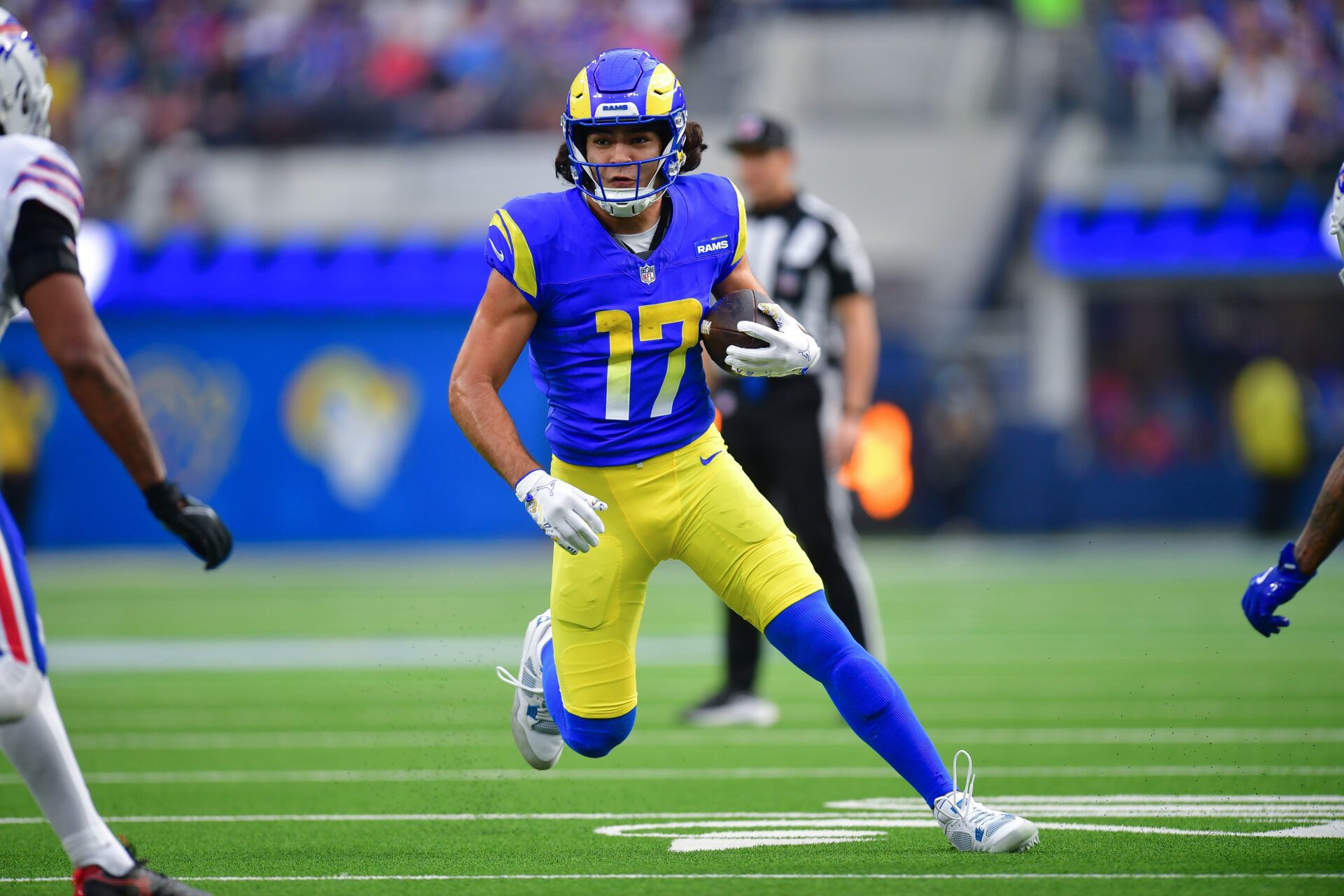 Los Angeles Rams wide receiver Puka Nacua (17) runs the ball against the Buffalo Bills during the first half at SoFi Stadium.
