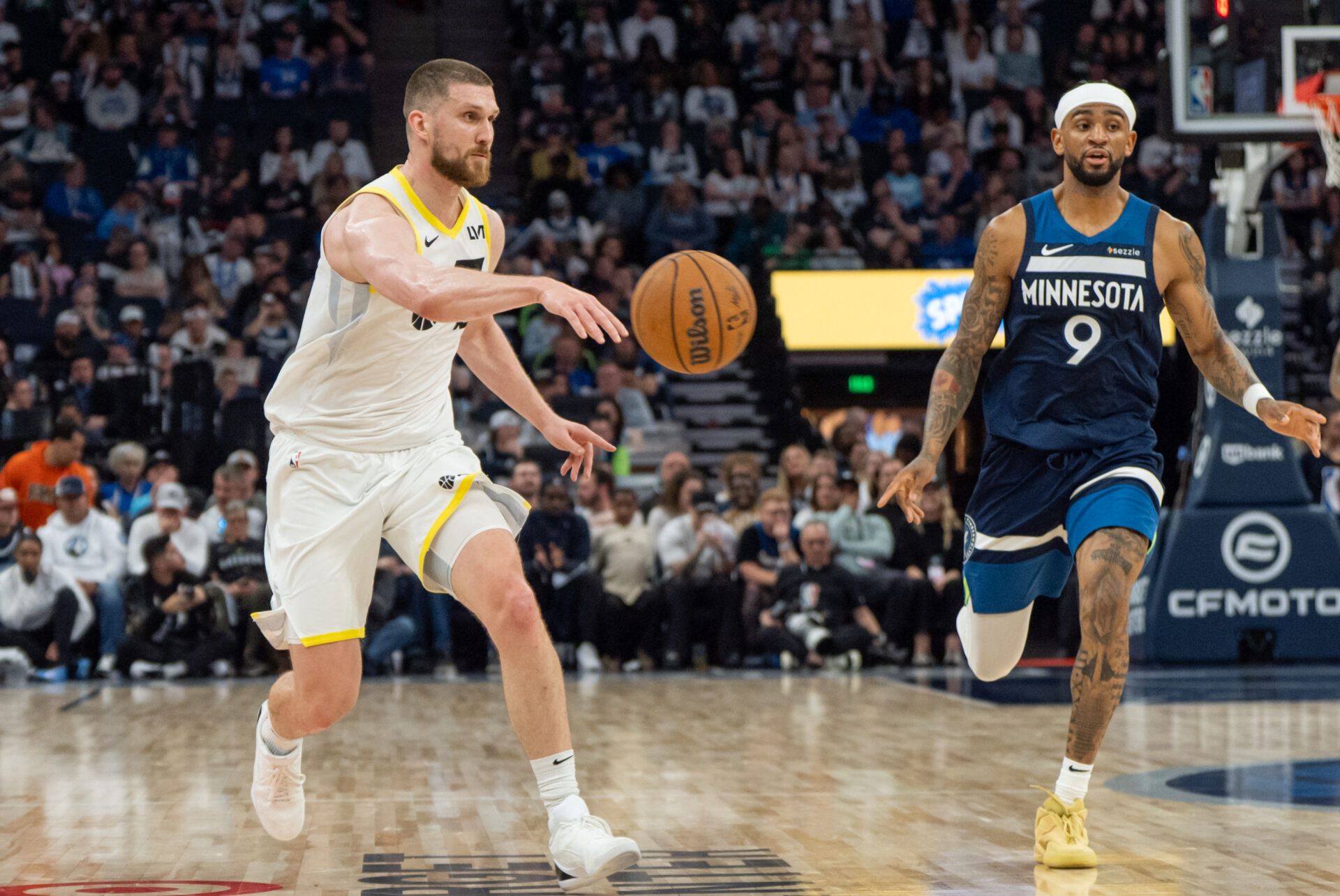 Utah Jazz guard Svi Mykhailiuk (19) passes to a teammate against the Minnesota Timberwolves in the fourth quarter at Target Center.