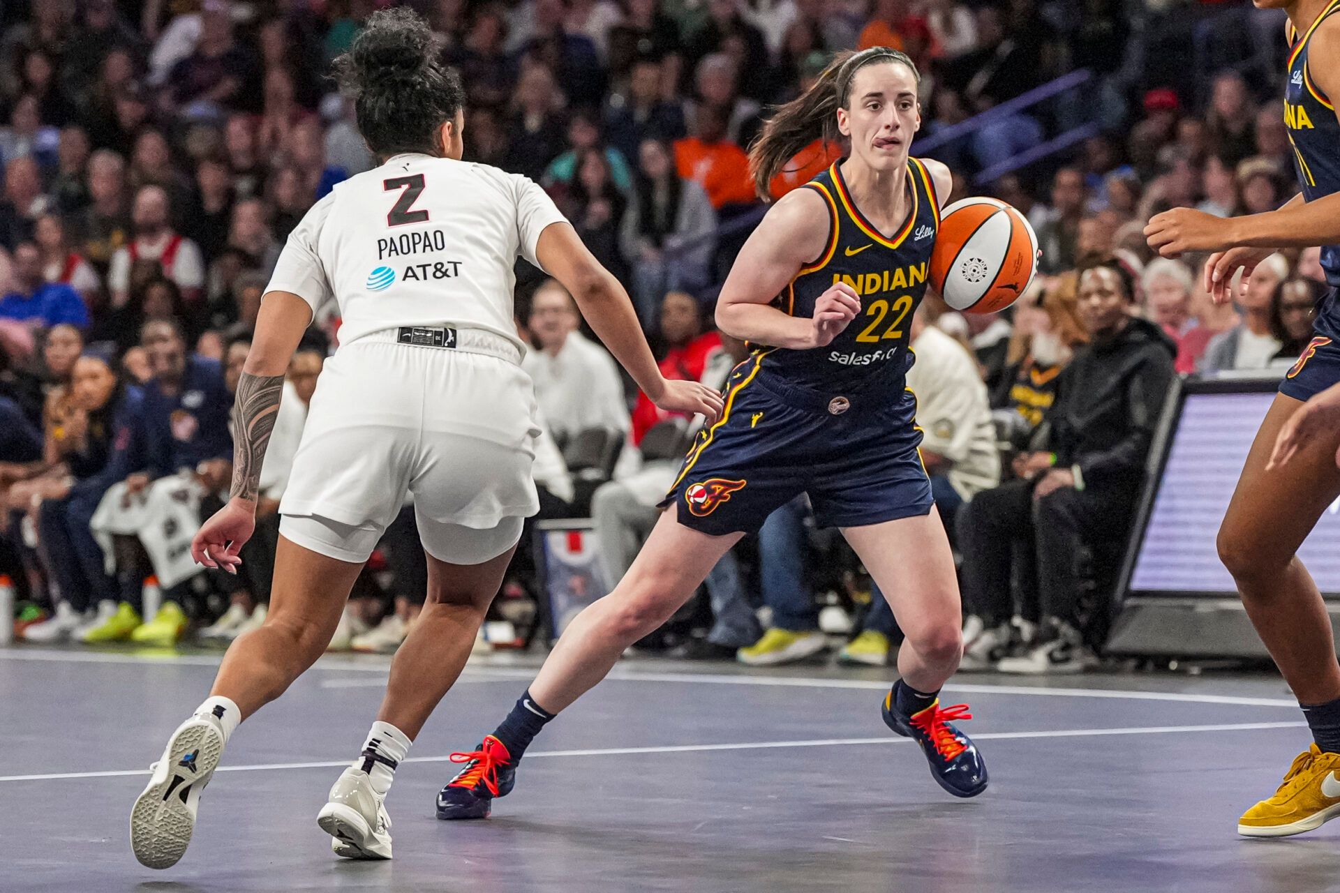 Indiana Fever guard Caitlin Clark (22) dribbles against Atlanta Dream guard Te-Hina Paopao (2) during the second half at Gateway Center Arena @ College Park.