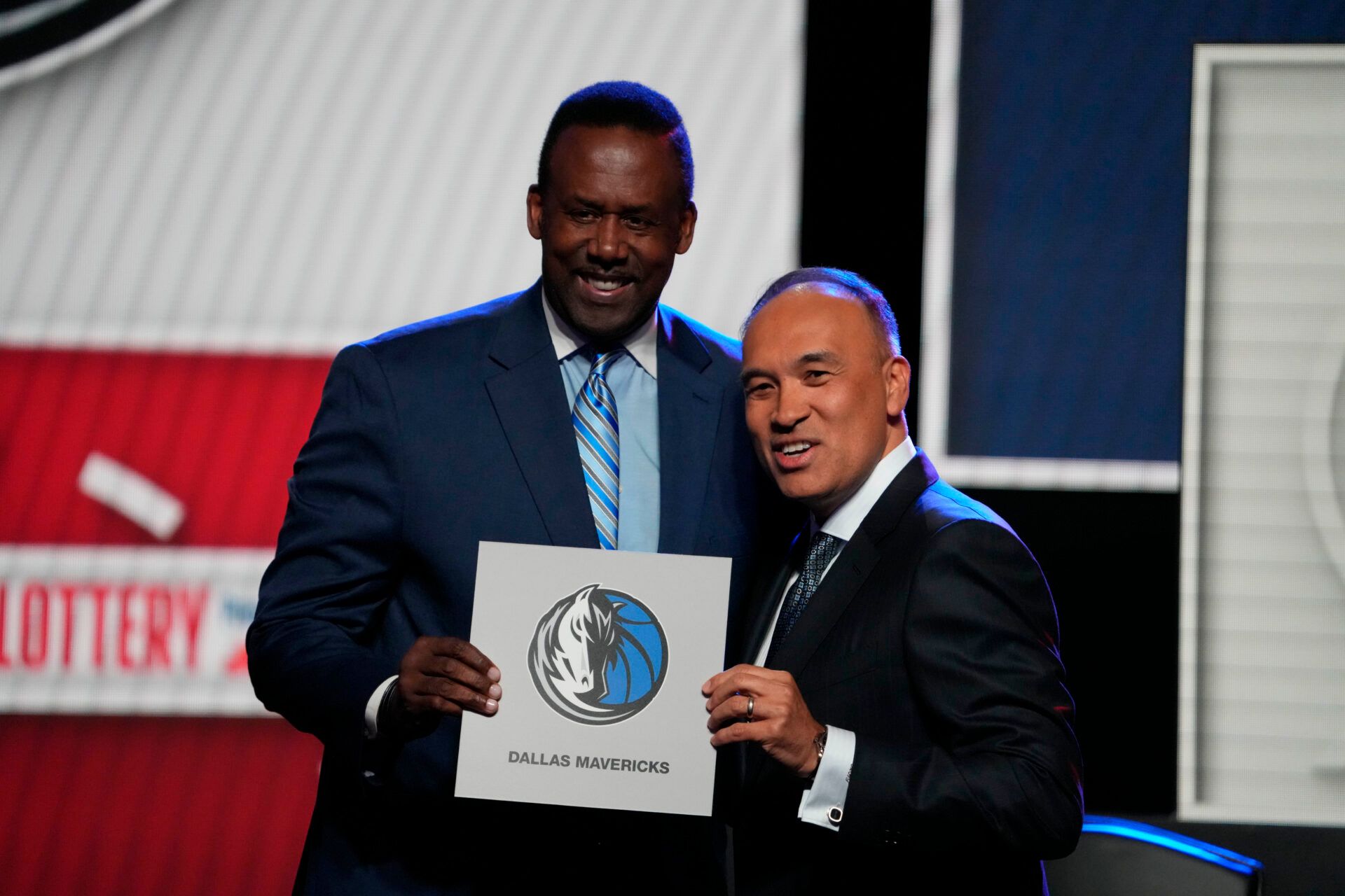 Rolando Blackman of the Dallas Mavericks poses with Mark Tatum NBA Deputy Commissioner after winning the the first pick during the 2025 NBA Draft Lottery at McCormick Place.