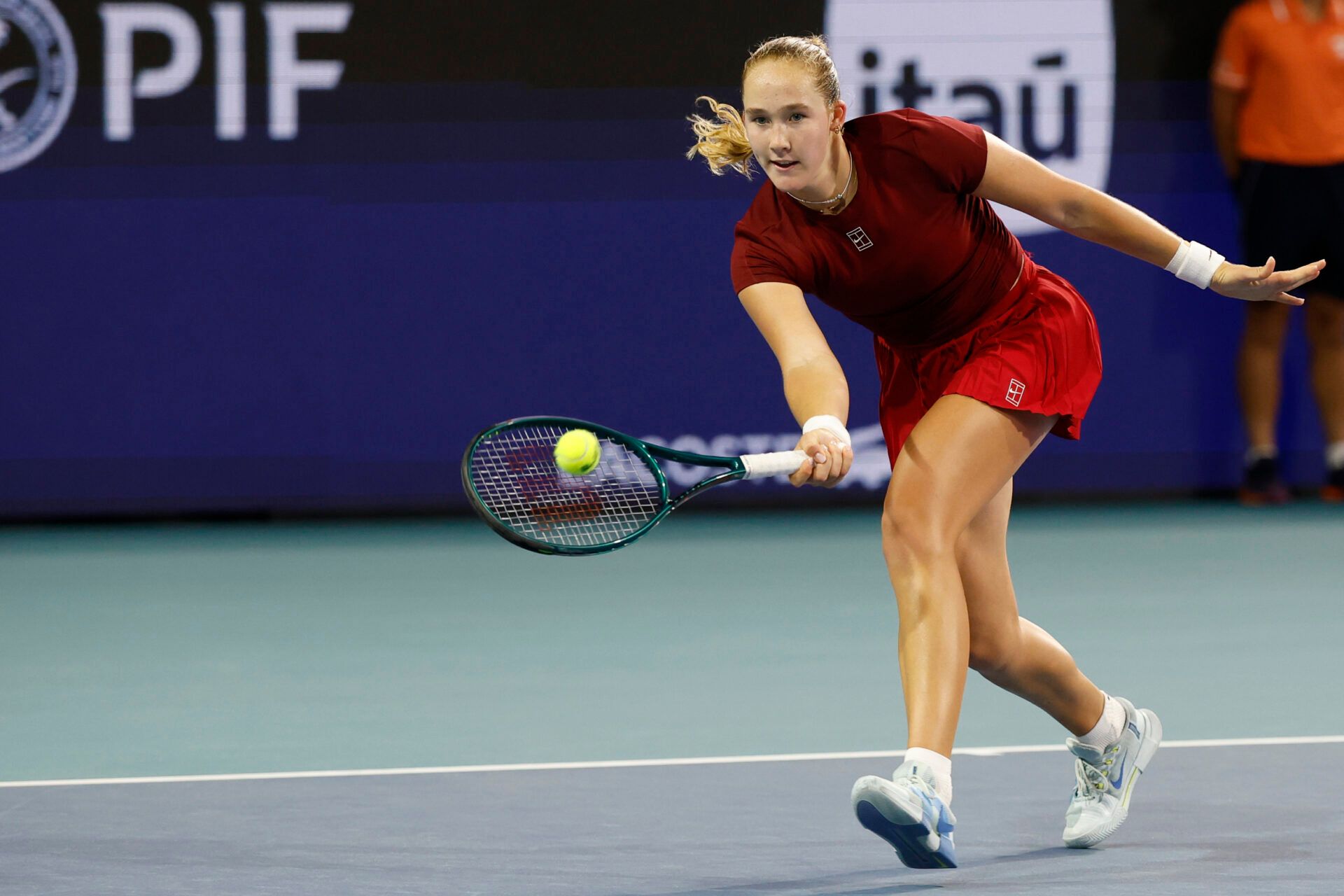 Mirra Andreeva hits a volley against Amanda Anisimova (USA)(not pictured) on day six of the Miami Open at Hard Rock Stadium.