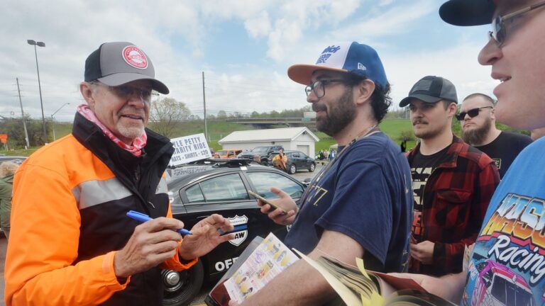 Former NASCAR great Kyle Petty signs autographs during a stop for Kyle Petty's 29th annual Charity Ride Across America at the Travel America truck stop in Harborcreek Township on May 5, 2025. At center is Nick Sanzo, 29, and Nick Seib, 28, is at far right.