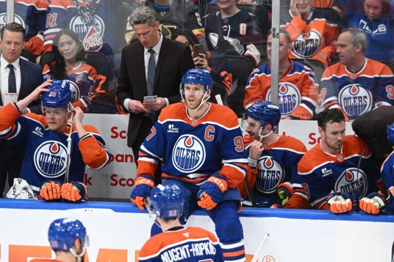 Edmonton Oilers centre Connor McDavid (97) is seen sitting on the players bench boards during the second period in game three of the second round of the 2025 Stanley Cup Playoffs at Rogers Place.