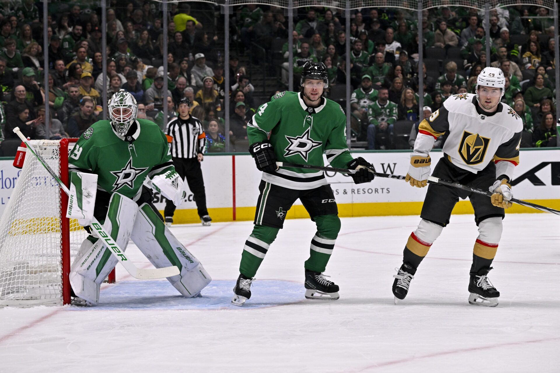 Dallas Stars goaltender Jake Oettinger (29) and defenseman Miro Heiskanen (4) and Vegas Golden Knights center Brendan Brisson (19) in action during the game between the Dallas Stars and the Vegas Golden Knights at the American Airlines Center.