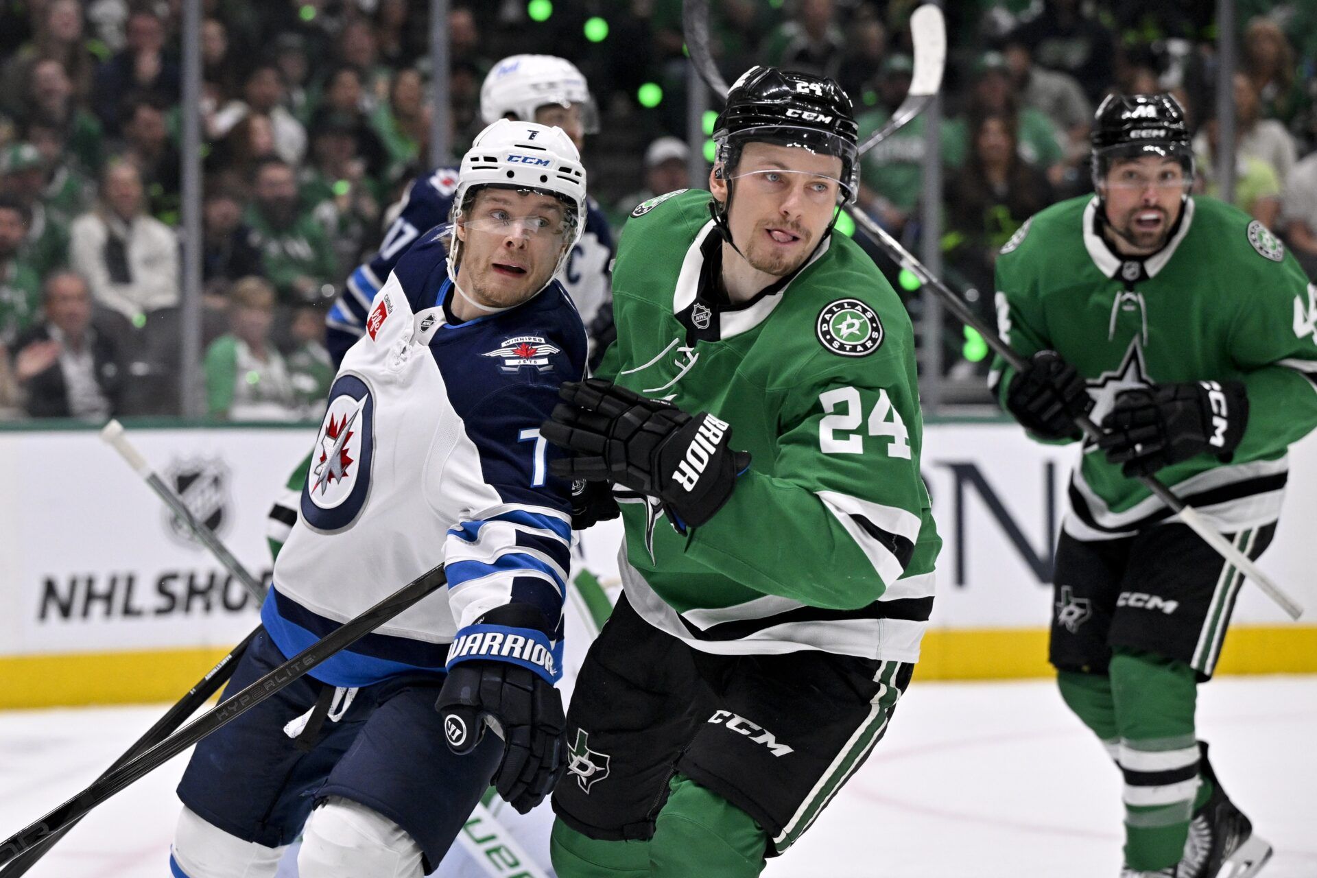 Winnipeg Jets center Vladislav Namestnikov (7) and Dallas Stars center Roope Hintz (24) look for the puck during the third period in game three of the second round of the 2025 Stanley Cup Playoffs at American Airlines Center.