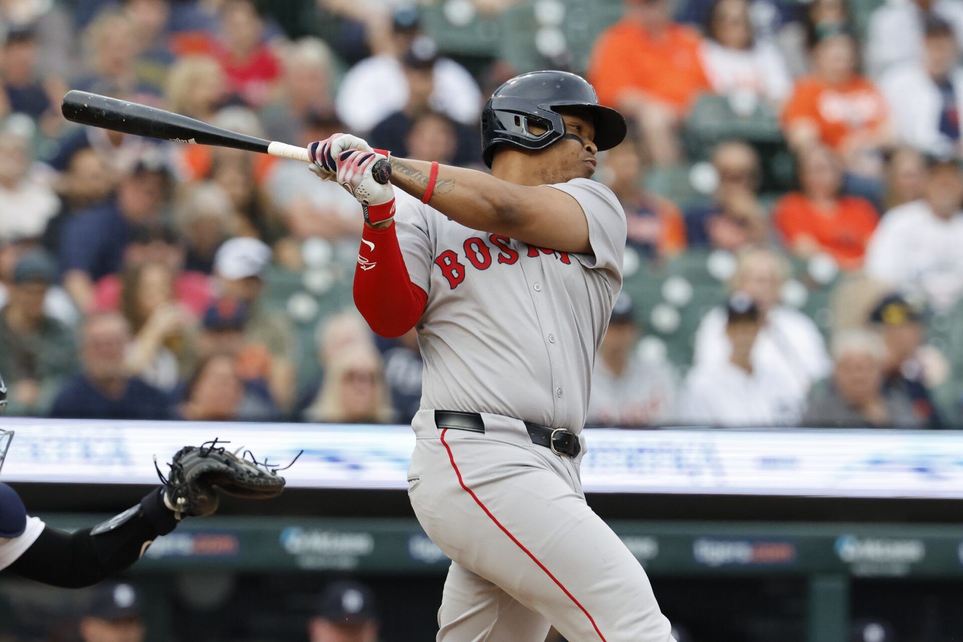 Boston Red Sox third base Rafael Devers (11) hits a single first inning against the Detroit Tigers at Comerica Park.
