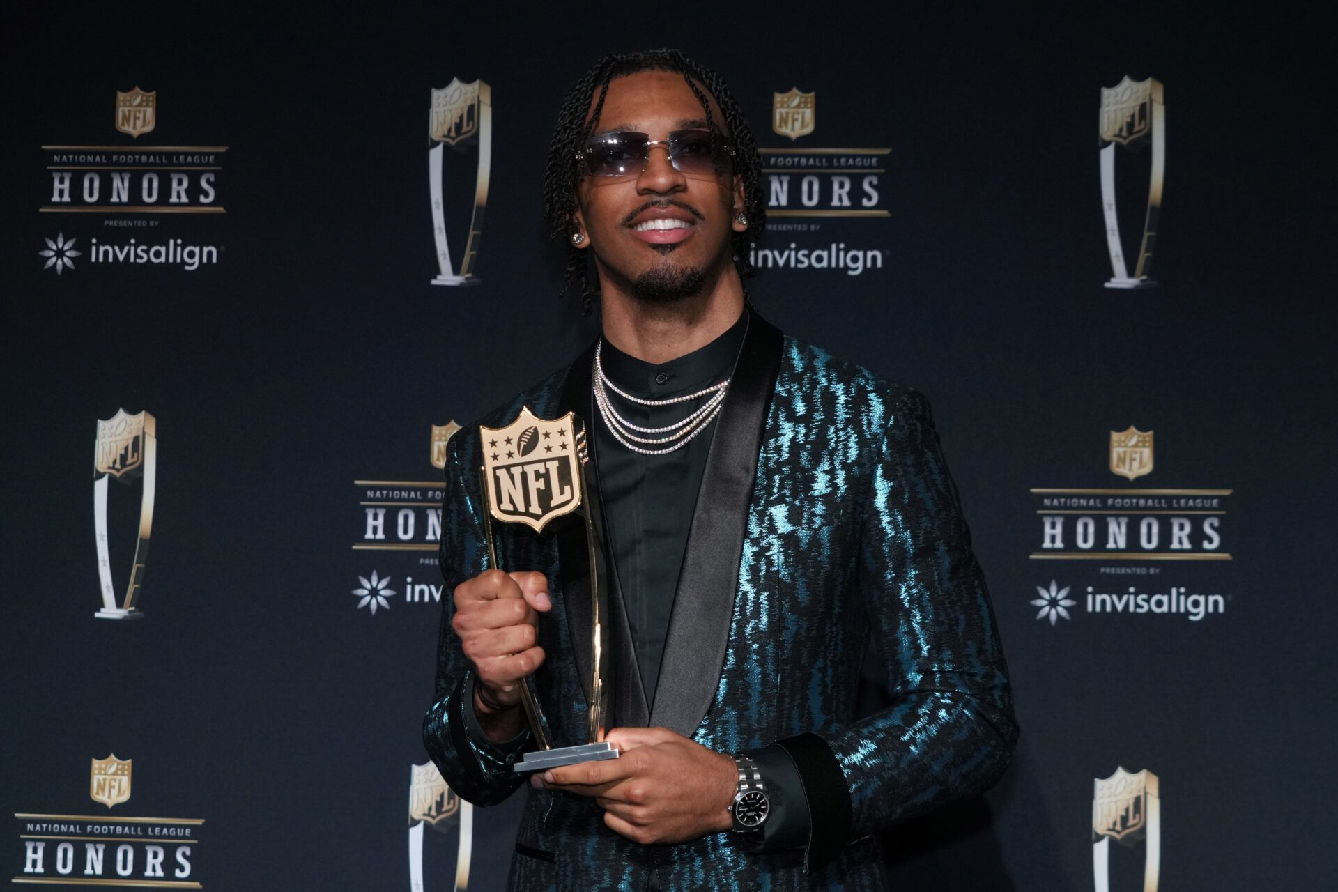Washington Commanders quarterback Jayden Daniels poses with the Offensive Rookie of the Year award during Super Bowl LIX NFL Honors at Saenger Theatre.