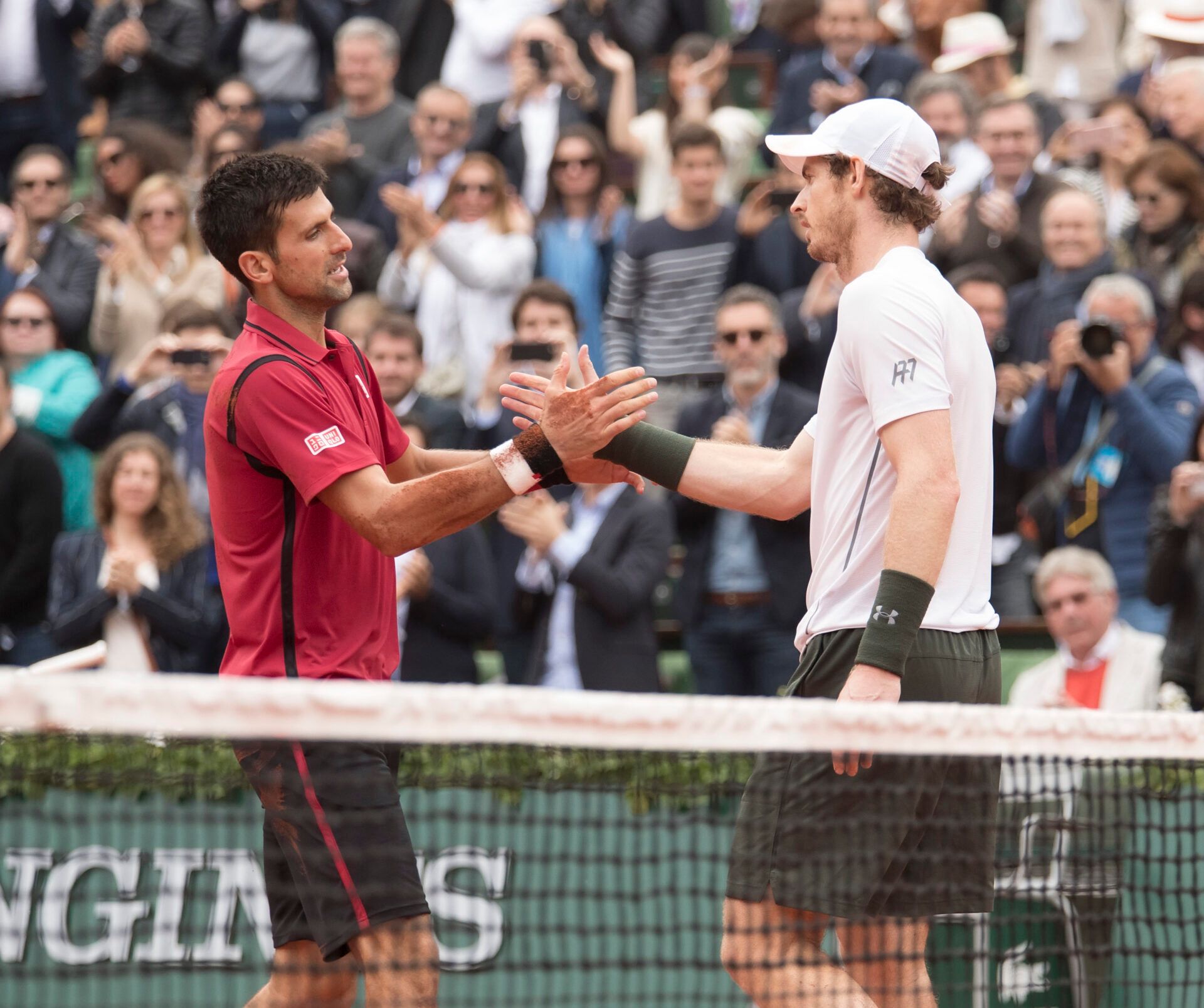 Novak Djokovic (SRB) and Andy Murray (GBR) at the net after their match on day 15 of the 2016 French Open.
