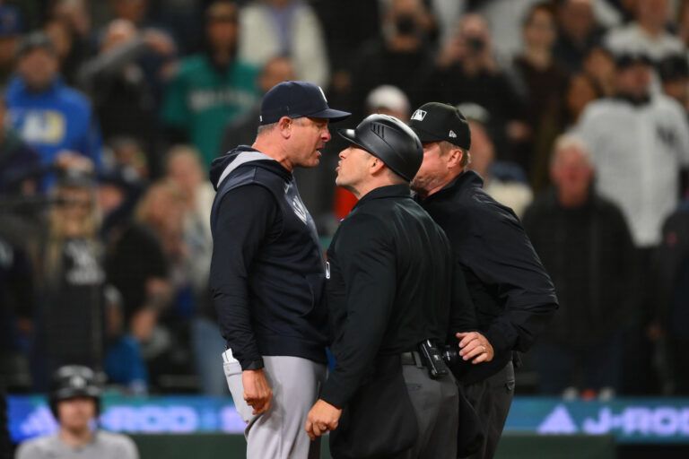 New York Yankees manager Aaron Boone argues with umpire Mark Wegner (14) after being ejected during the ninth inning against the Seattle Mariners at T-Mobile Park.