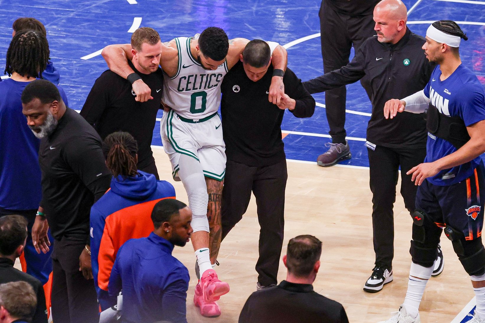 Boston Celtics forward Jayson Tatum (0) is helped off the court by after an injury in the second half during game four of the second round for the 2025 NBA Playoffs against the New York Knicks at Madison Square Garden. Tatum would leave the game with an injury after this play.