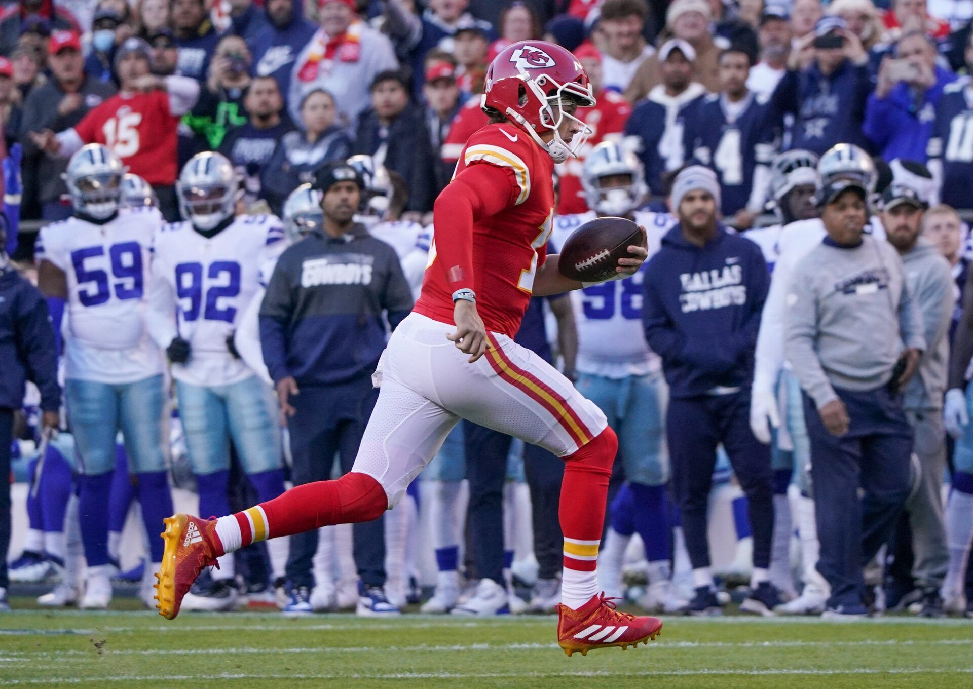 Kansas City Chiefs quarterback Patrick Mahomes (15) runs the ball against the Dallas Cowboys during the game at GEHA Field at Arrowhead Stadium.