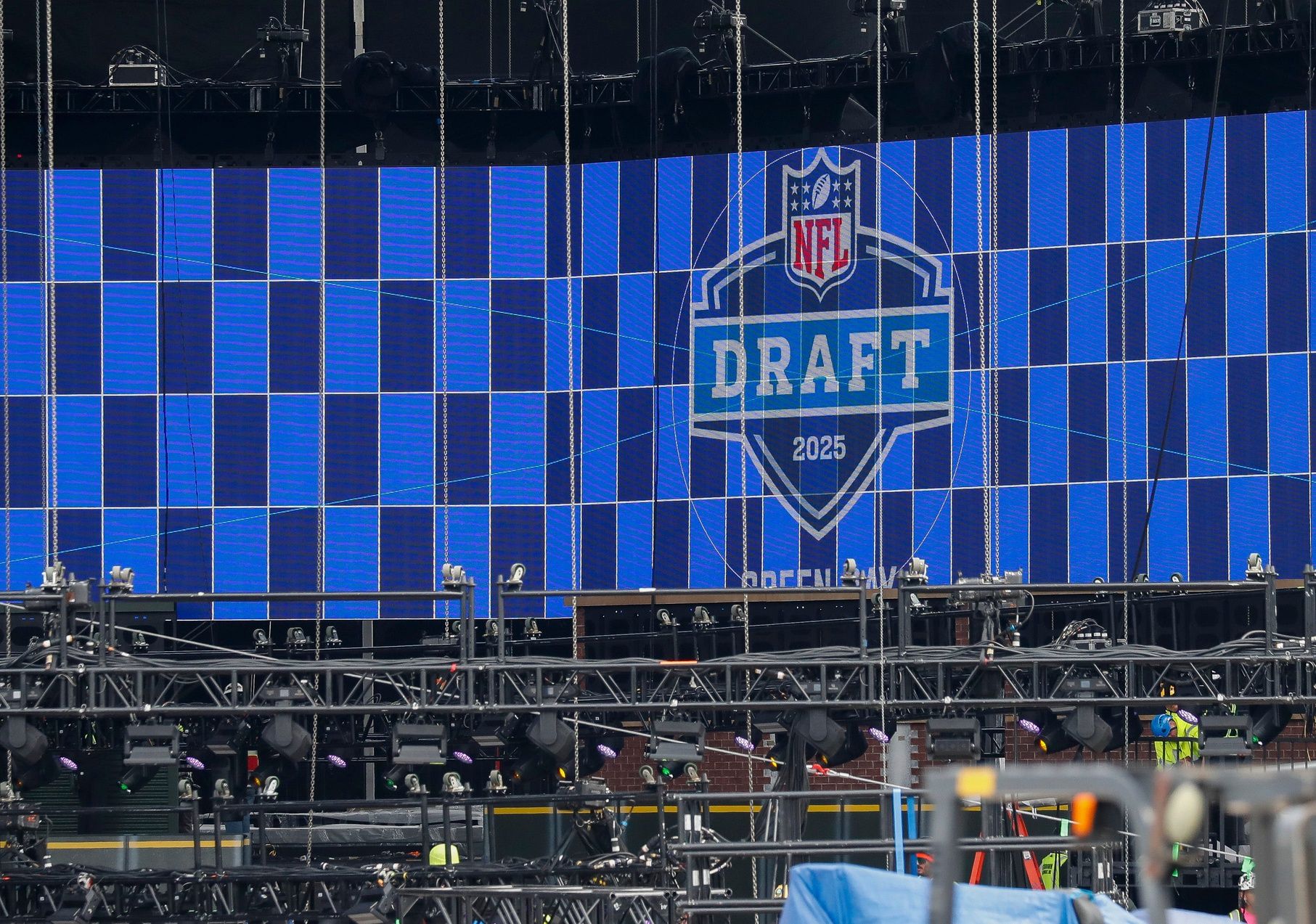 A video board displays the 2025 NFL Draft logo as the NFL Draft Theater is under construction on Thursday, April 17, 2025, at Lambeau Field in Green Bay, WI. The 2025 NFL Draft will be held April 24-26.