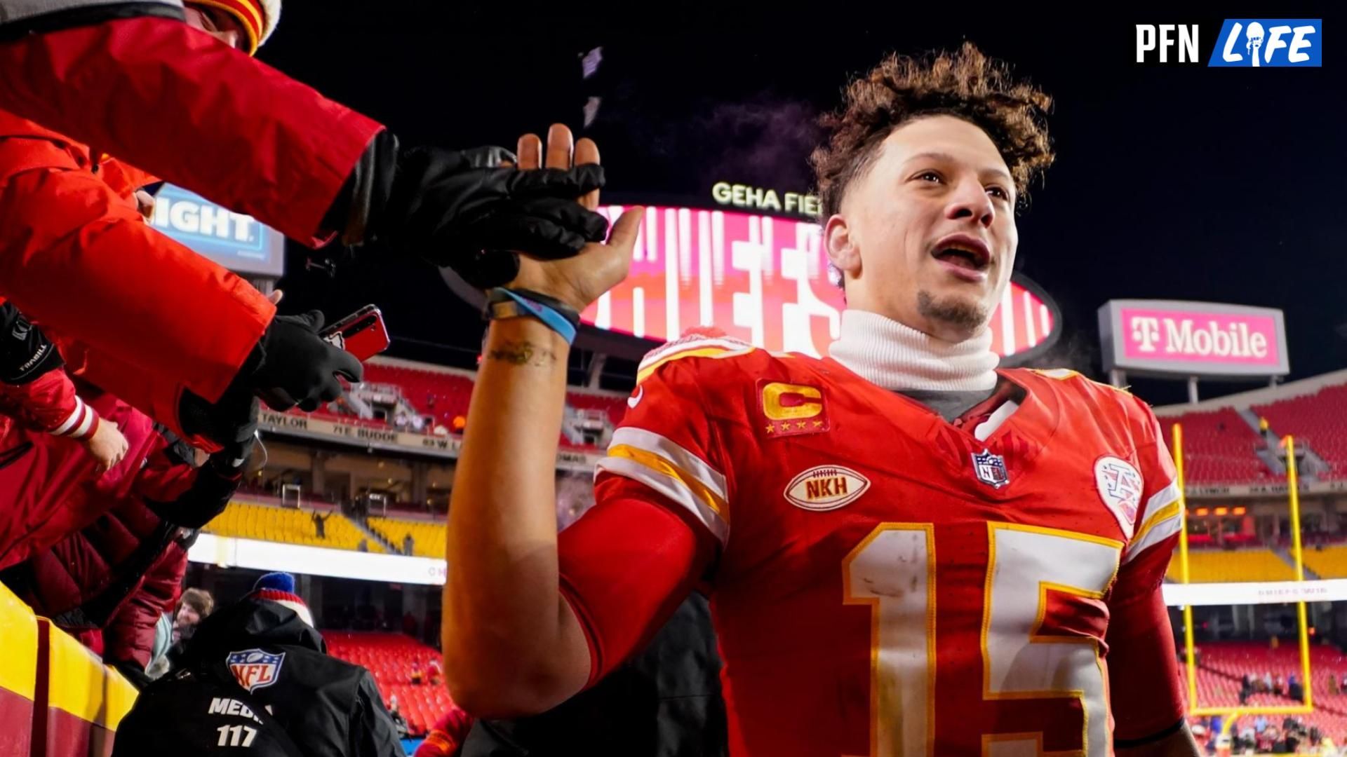 Kansas City Chiefs quarterback Patrick Mahomes (15) greets fans after defeating the Miami Dolphins in a 2024 AFC wild card game at GEHA Field at Arrowhead Stadium.