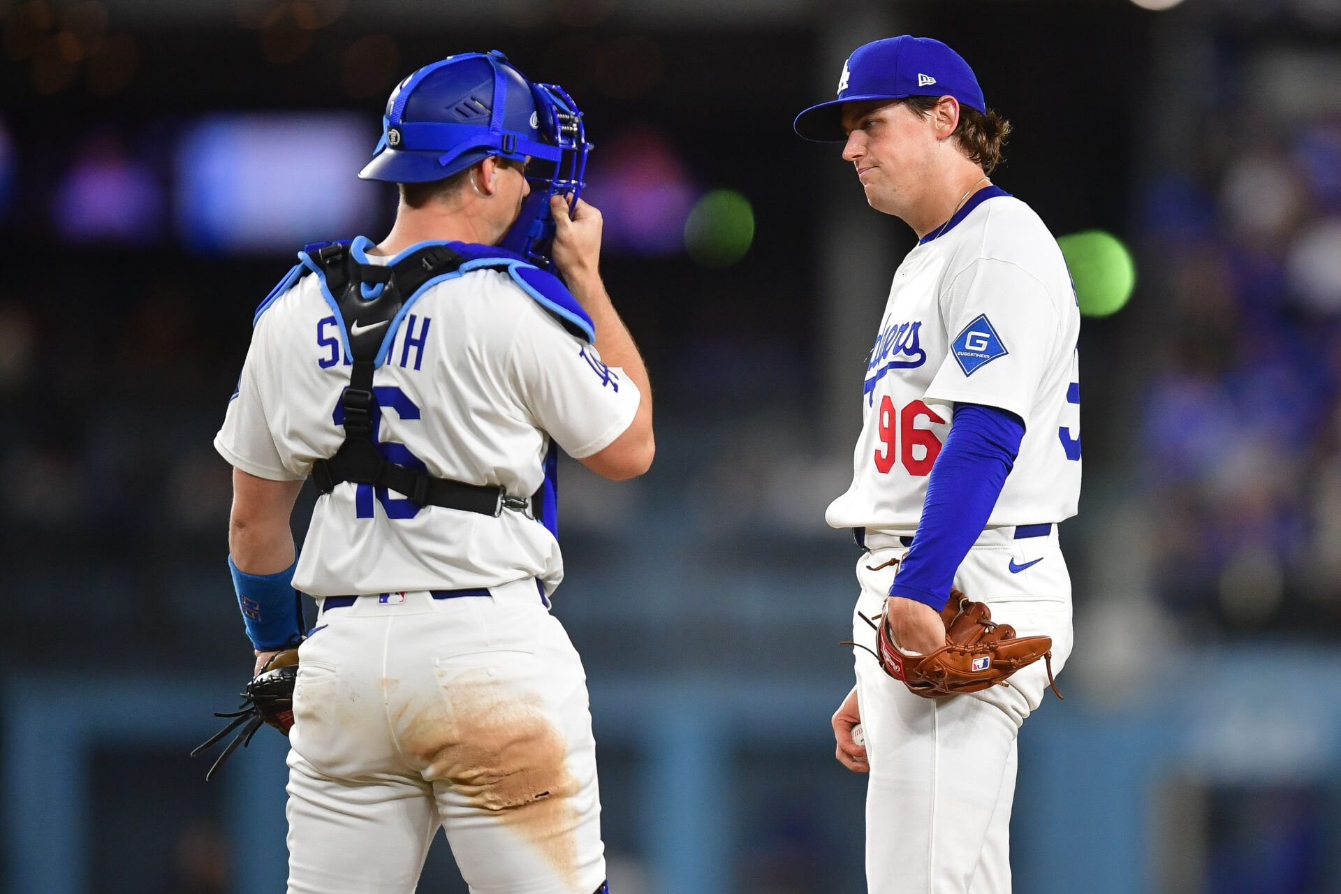 Los Angeles Dodgers pitcher Landon Knack (96) meets with catcher Will Smith (16) before being relieved during the fifth inning at Dodger Stadium.