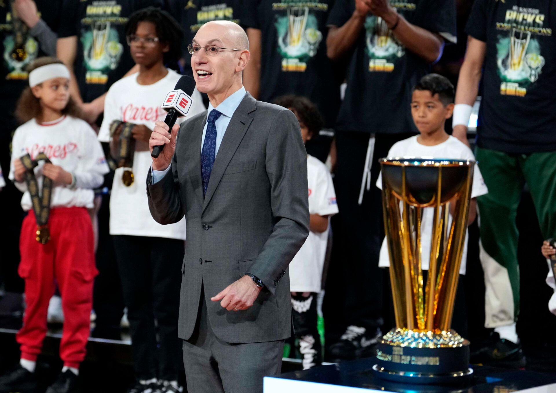 NBA commissioner Adam Silver presents the trophy to the Milwaukee Bucks after they won the Emirates NBA Cup championship game against the Oklahoma City Thunder at T-Mobile Arena.