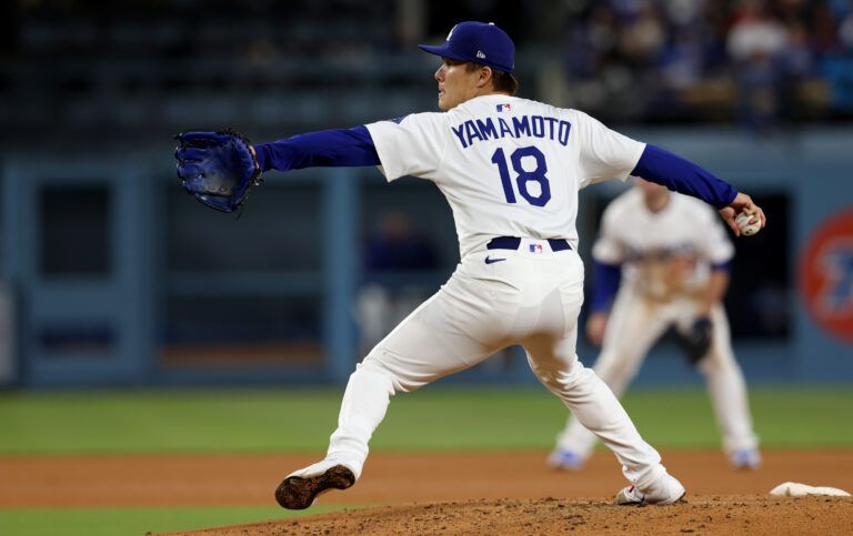 Los Angeles Dodgers pitcher Yoshinobu Yamamoto (18) throws during the fifth inning against the Athletics at Dodger Stadium.