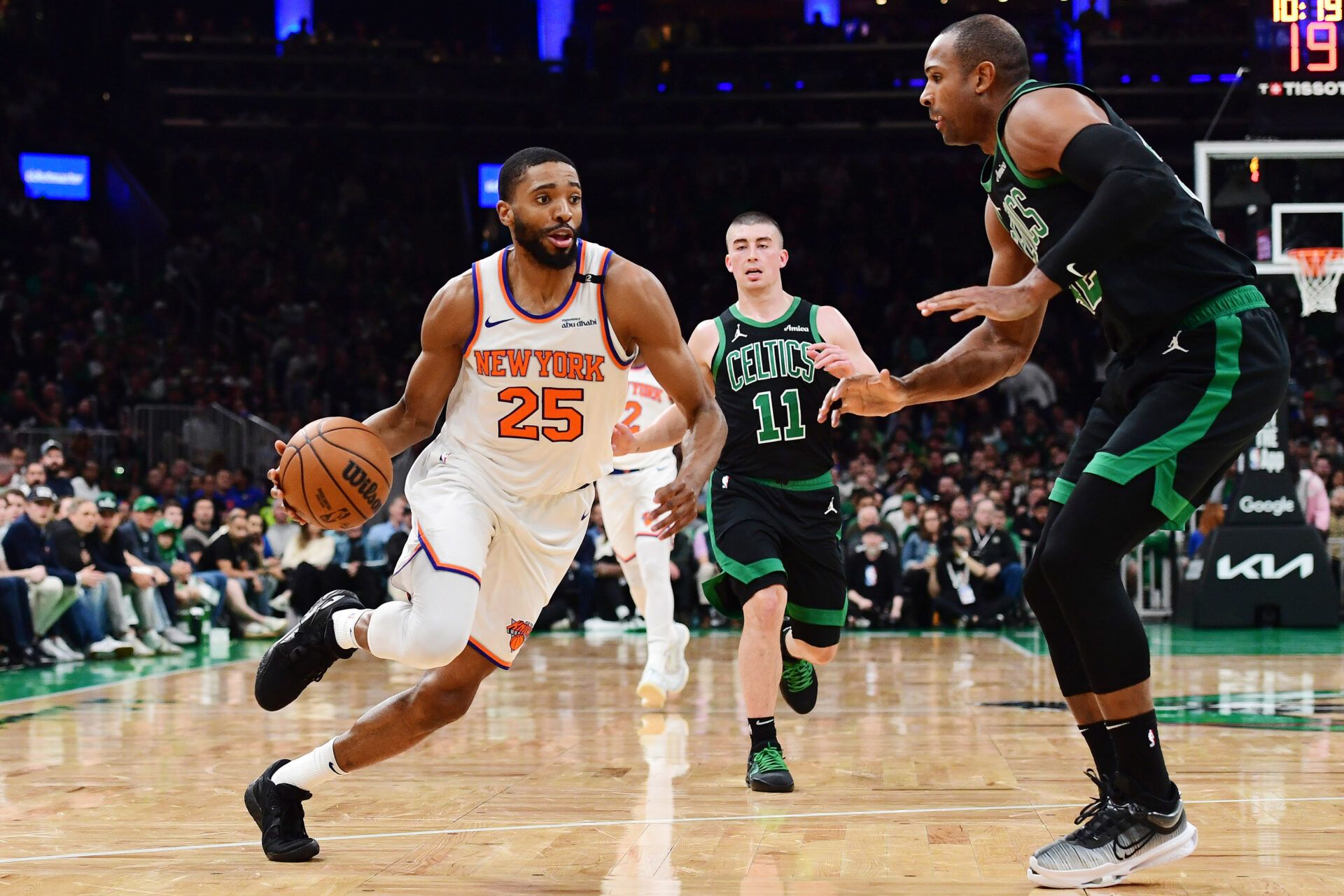 New York Knicks forward Mikal Bridges (25) controls the ball while Boston Celtics center Al Horford (42) defends in the first half during game five of the second round for the 2025 NBA Playoffs at TD Garden.