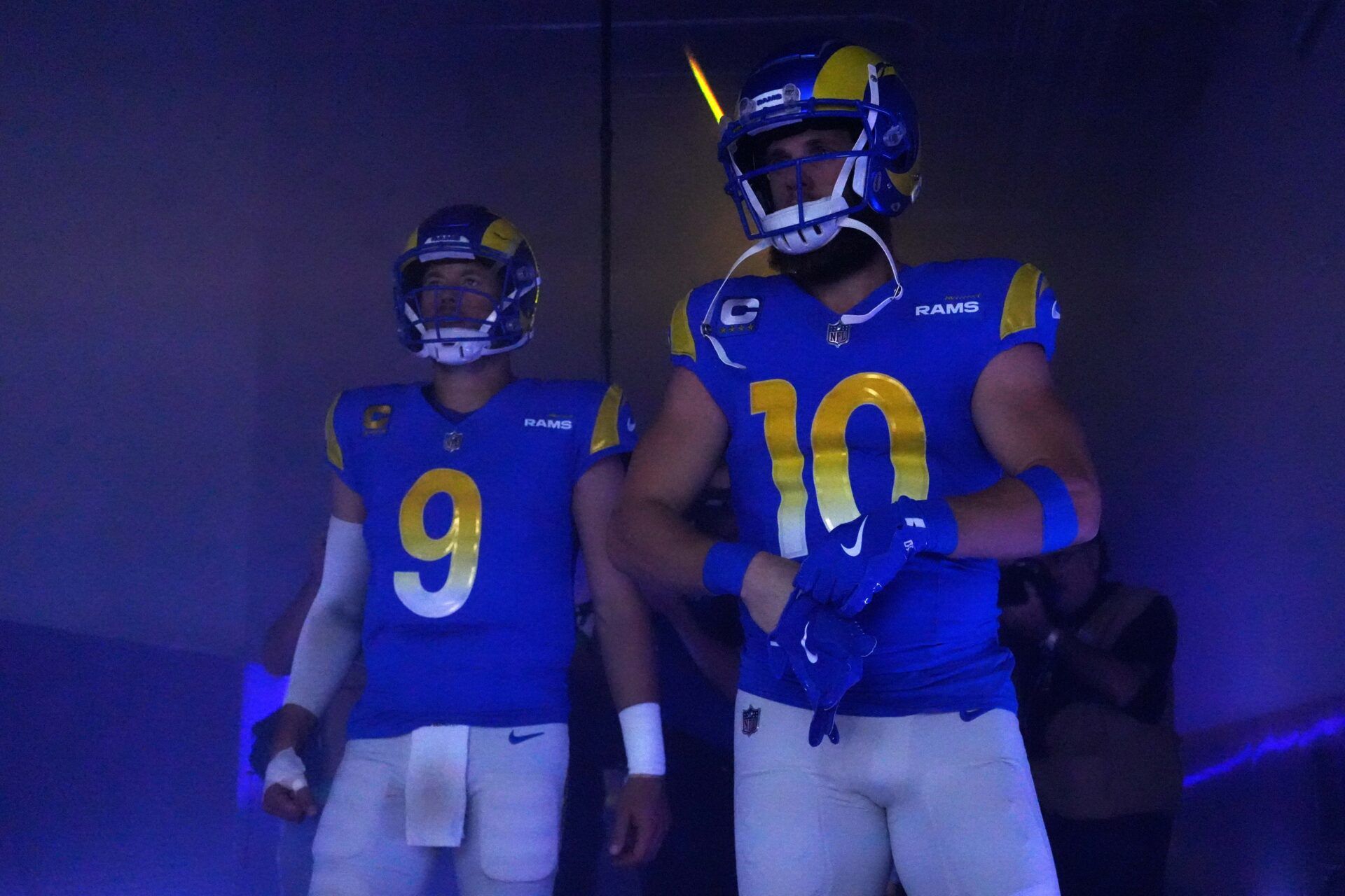 Los Angeles Rams quarterback Matthew Stafford (9) and wide receiver Cooper Kupp (10) enter the field before the game against the Washington Commanders at SoFi Stadium.