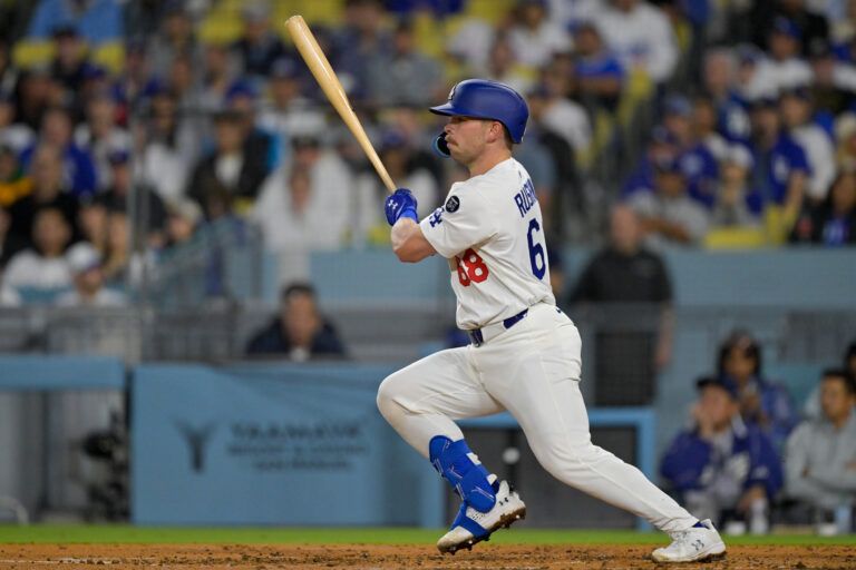 Los Angeles Dodgers catcher Dalton Rushing (68) singles against the Athletics during the third inning of the game at Dodger Stadium.