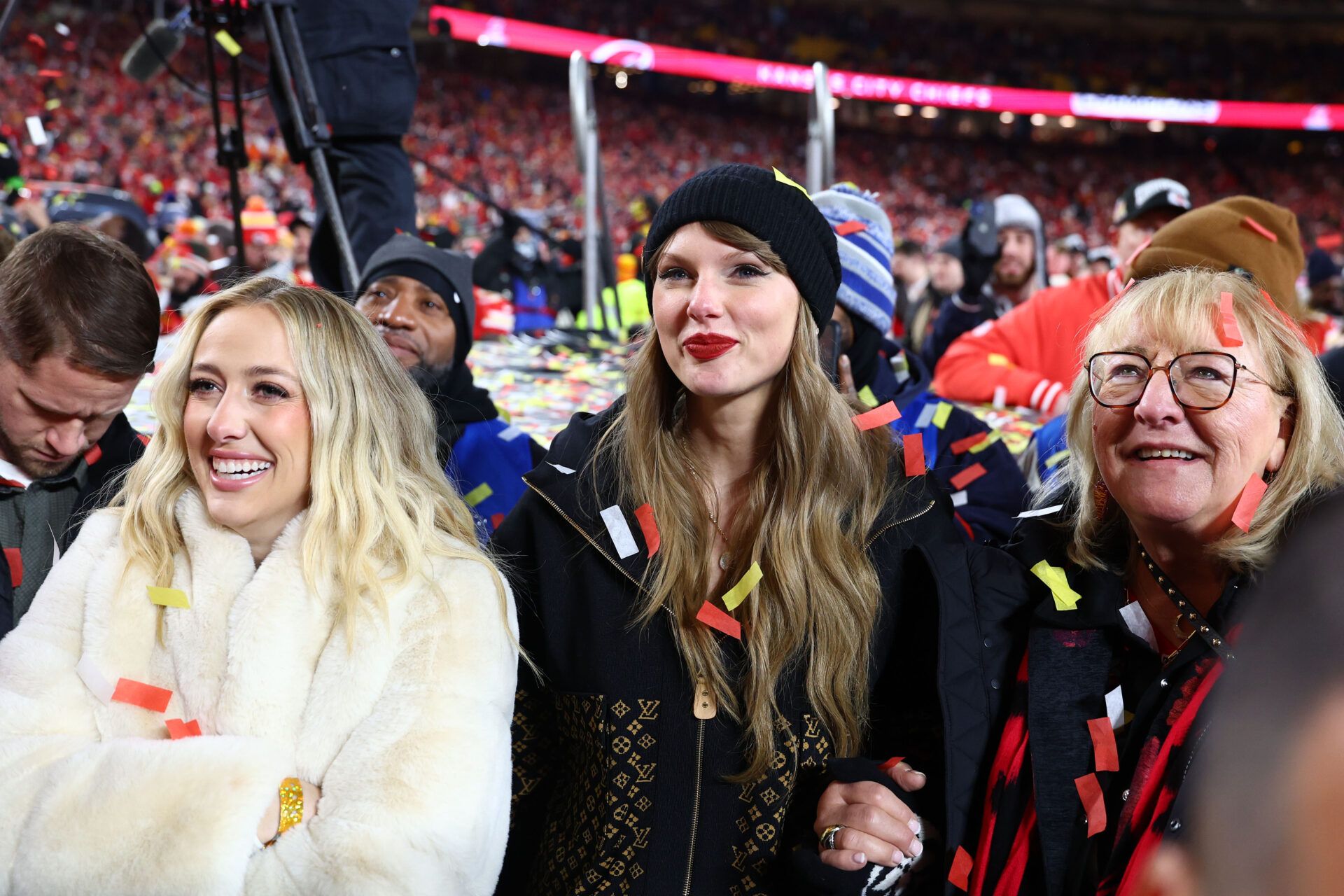 Recording artist Taylor Swift (center) Brittany Mahomes (left) and Donna Kelce (right) react after the AFC Championship game against the Buffalo Bills at GEHA Field at Arrowhead Stadium.