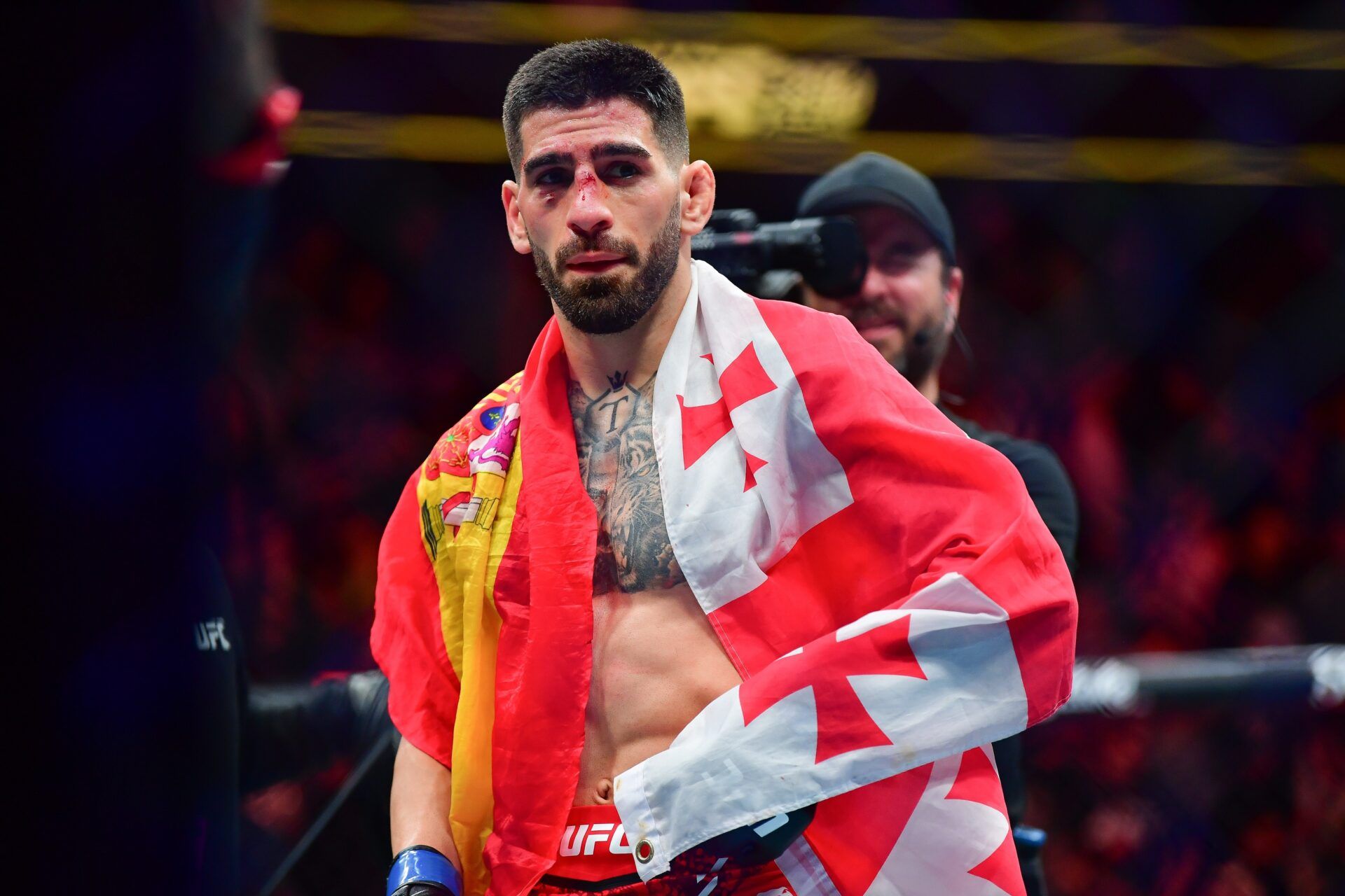 Ilia Topuria celebrates his championship victory against Alexander Volkanovski during UFC 298 at Honda Center.