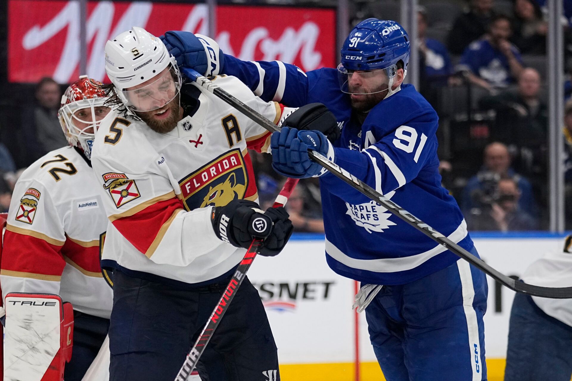 Toronto Maple Leafs forward John Tavares (91) checks Florida Panthers defenseman Aaron Ekblad (5) during the third period of game five of the second round of the 2025 Stanley Cup Playoffs at Scotiabank Arena.