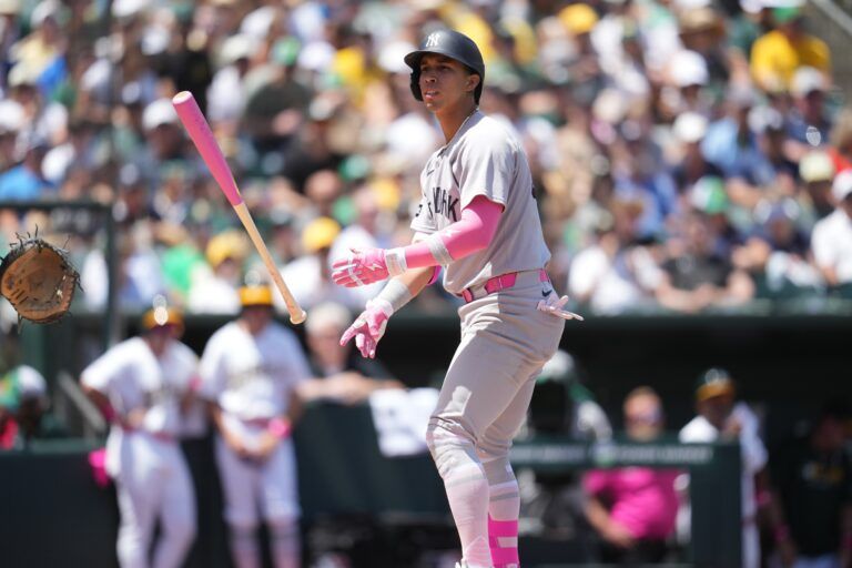 New York Yankees infielder Oswaldo Cabrera (95) tosses his bat after drawing a walk against the Athletics in the second inning at Sutter Health Park.