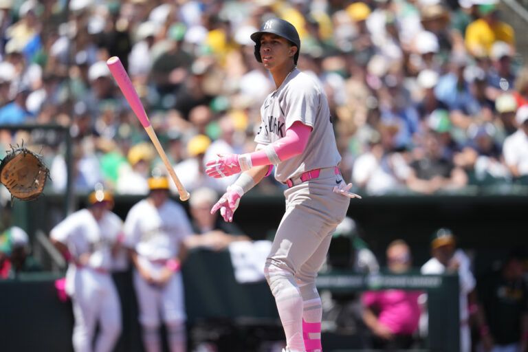 New York Yankees infielder Oswaldo Cabrera (95) tosses his bat after drawing a walk against the Athletics in the second inning at Sutter Health Park.