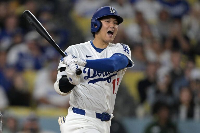 Los Angeles Dodgers designated hitter Shohei Ohtani (17) hits a solo home run in the seventh inning against the Los Angeles Angels at Dodger Stadium.