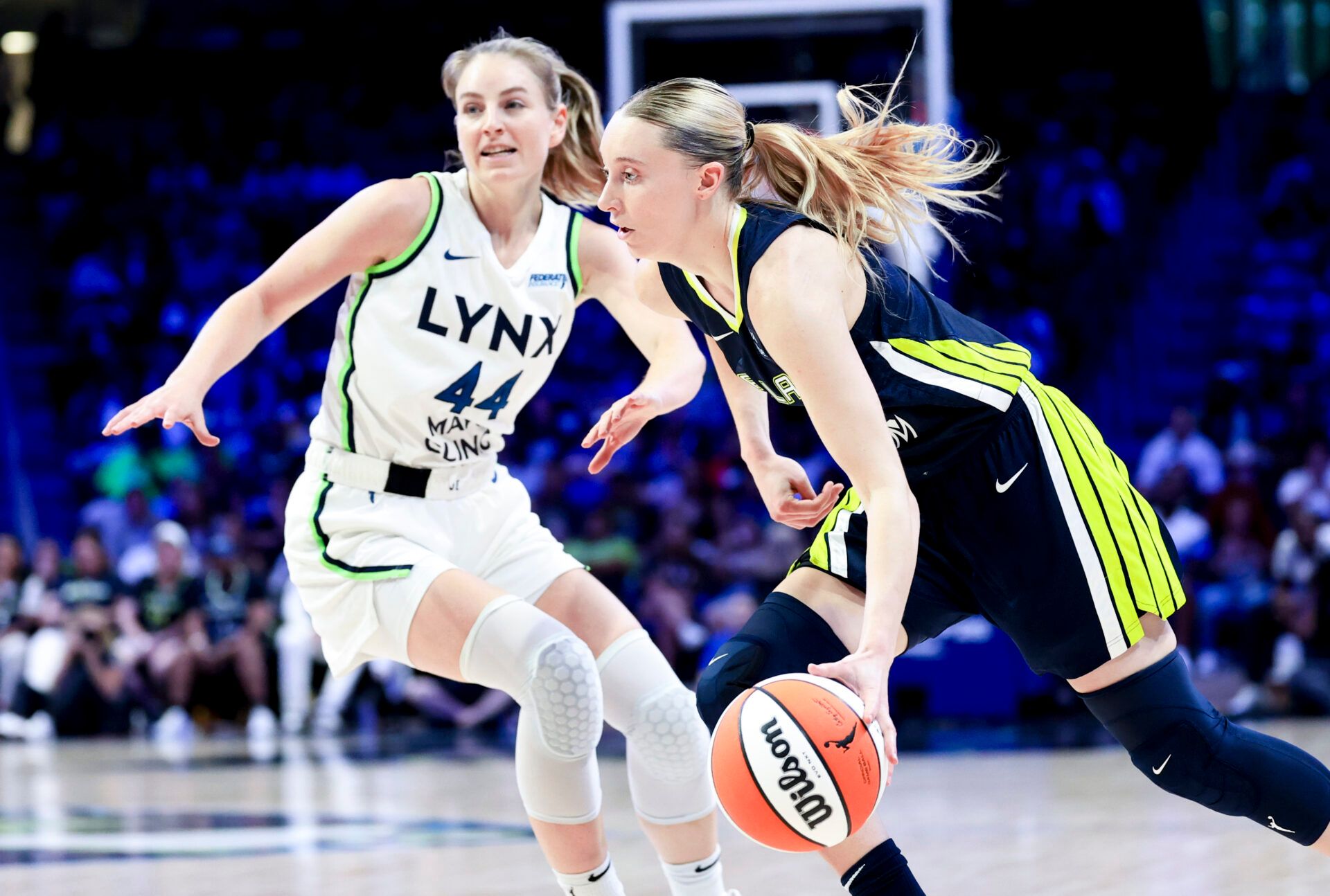 Dallas Wings guard Paige Bueckers (5) drives to the basket as Minnesota Lynx forward Karlie Samuelson (44) defends during the second half at College Park Center.