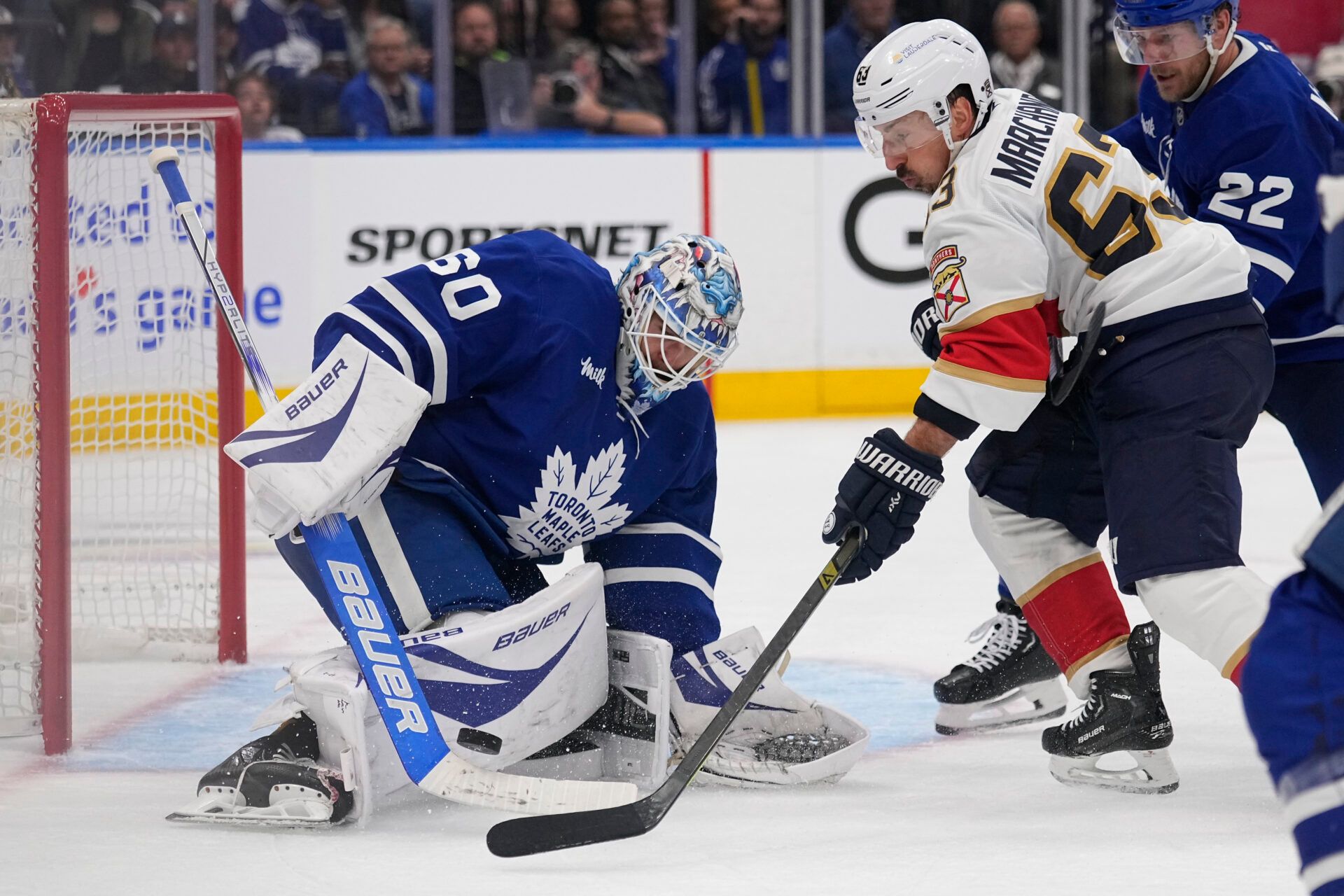 Toronto Maple Leafs goaltender Joseph Woll (60) makes a save against Florida Panthers forward Brad Marchand (63) during the second period of game five of the second round of the 2025 Stanley Cup Playoffs at Scotiabank Arena.