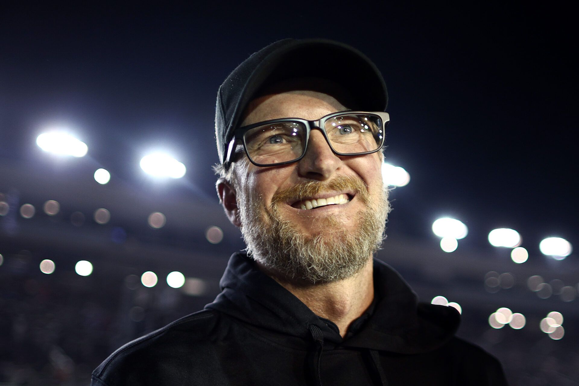 AVONDALE, ARIZONA - NOVEMBER 09: NASCAR Hall of Famer and JR Motorsports owner, Dale Earnhardt Jr. reacts to Justin Allgaier, driver of the #7 BRANDT Chevrolet, winning the 2024 NASCAR Xfinity Series Championship in the NASCAR Xfinity Series Championship Race at Phoenix Raceway on November 09, 2024 in Avondale, Arizona. (Photo by Jared C. Tilton/Getty Images)