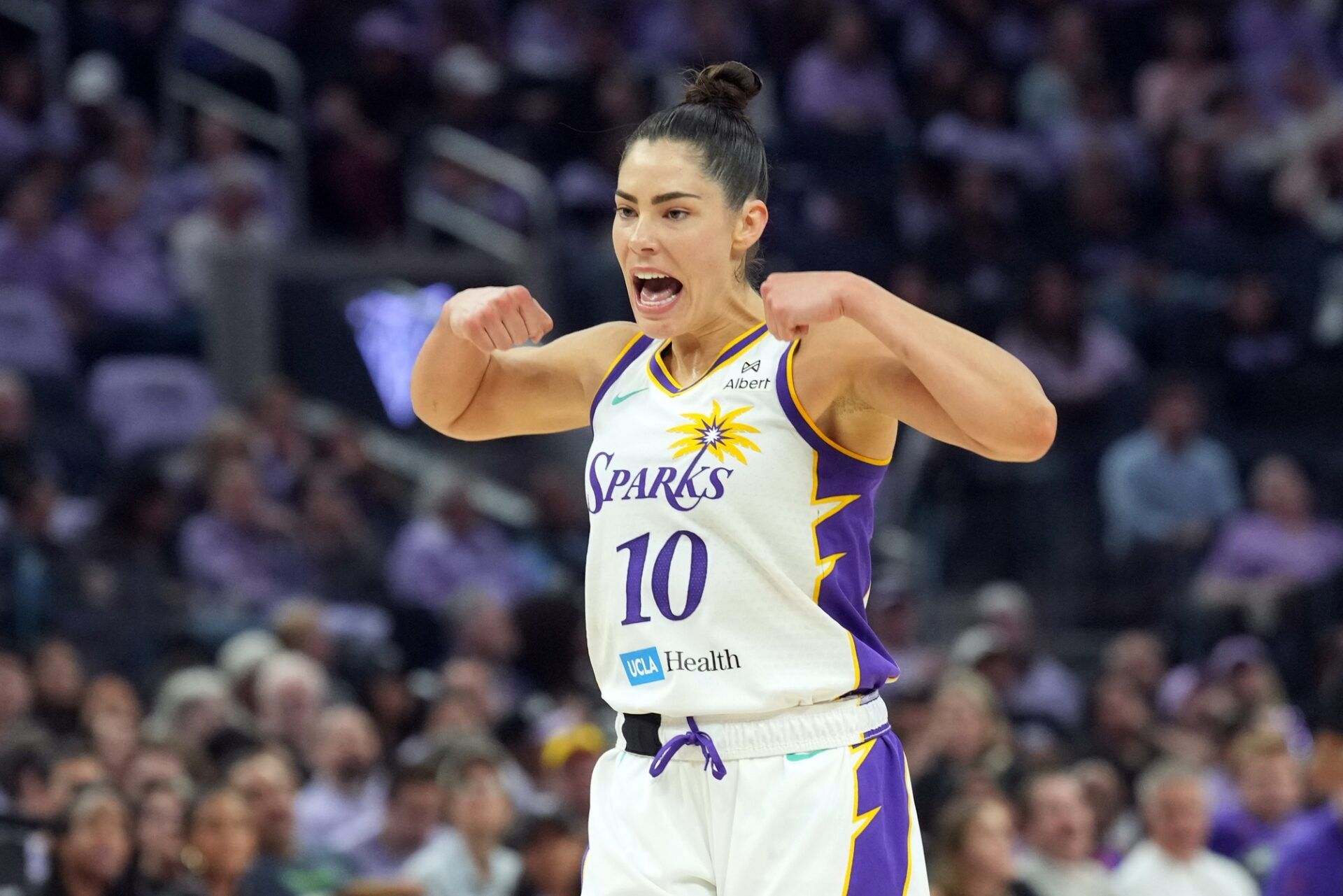 Los Angeles Sparks guard Kelsey Plum (10) gestures after a basket by forward Rickea Jackson (not shown) during the second quarter against the Golden State Valkyries at Chase Center.