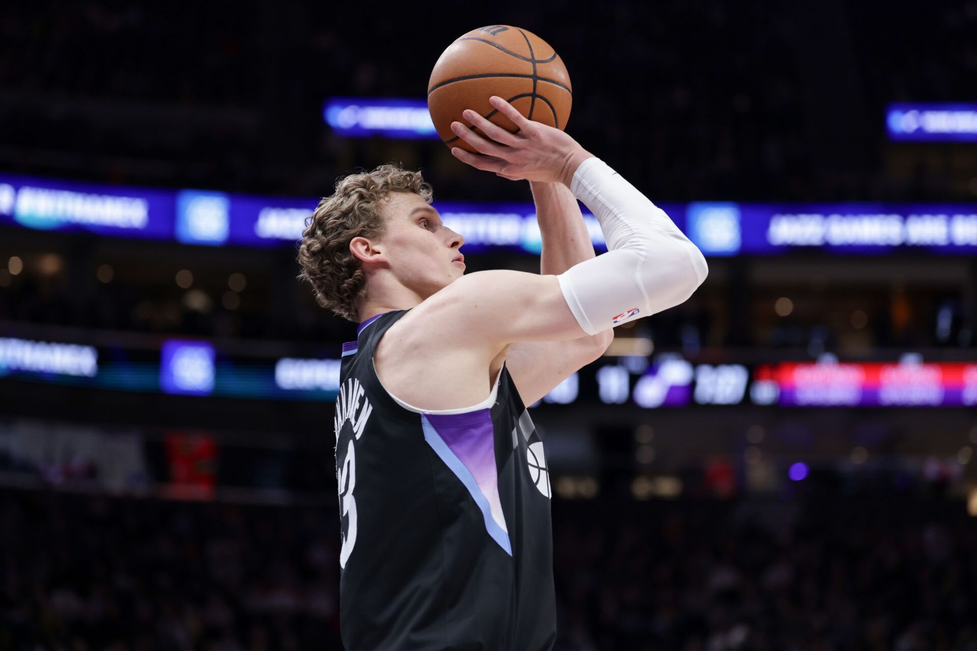 Utah Jazz forward Lauri Markkanen (23) shoots a three point basket during the first quarter against the Toronto Raptors at Delta Center.
