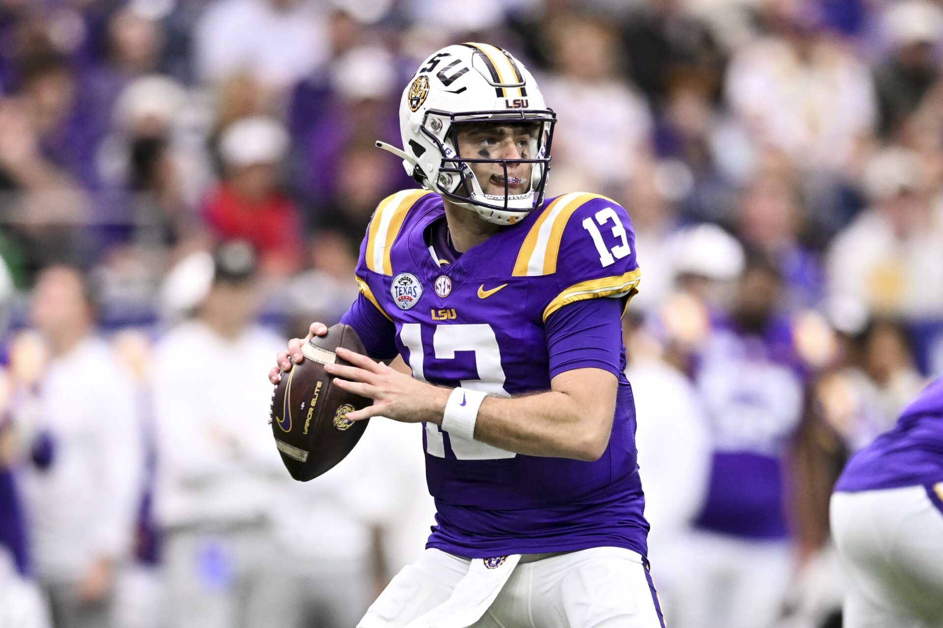 LSU Tigers quarterback Garrett Nussmeier (13) throws a pass during the first half against the Baylor Bears at NRG Stadium.