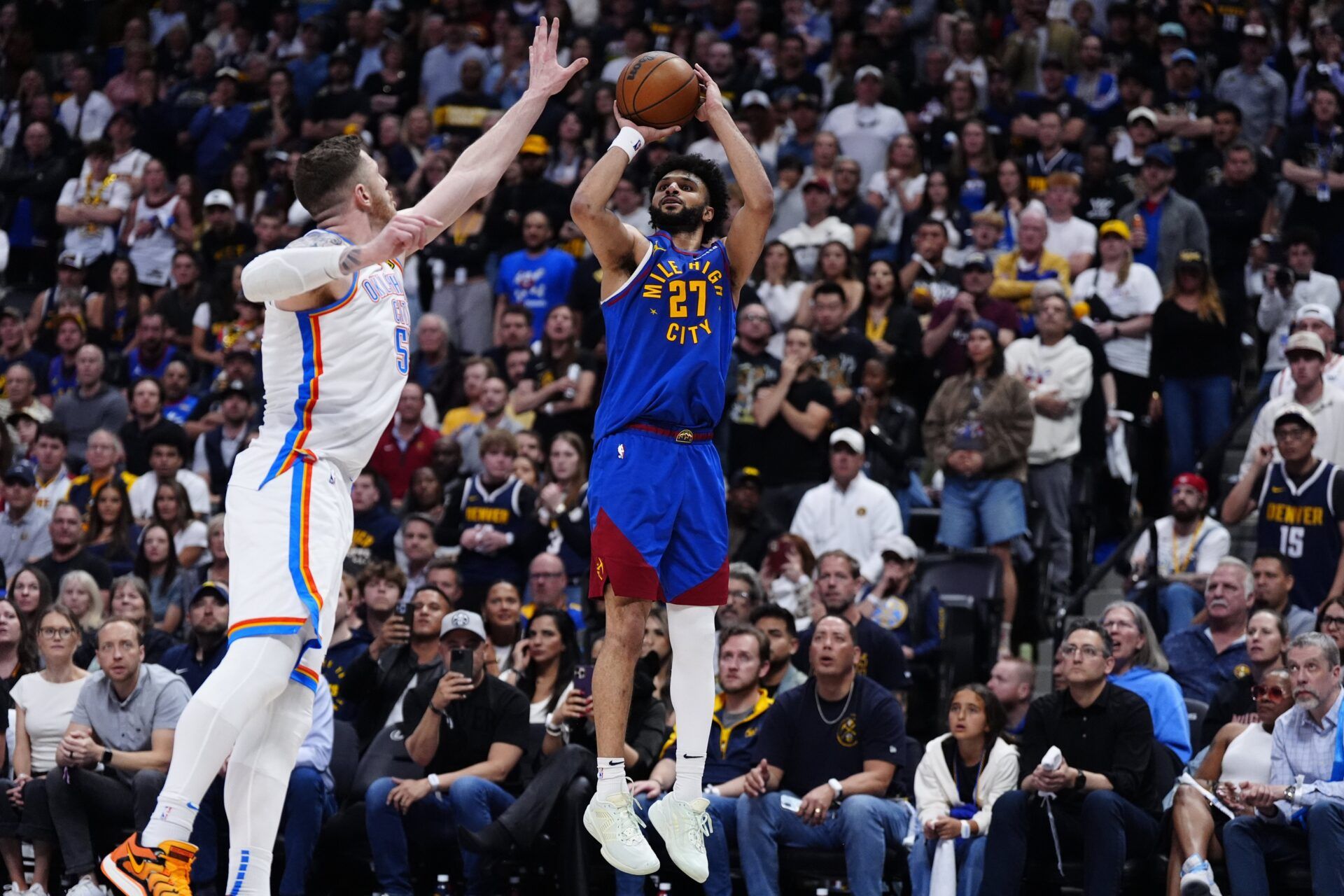 Oklahoma City Thunder center Isaiah Hartenstein (55) defends on Denver Nuggets guard Jamal Murray (27) in the overtime during game three of the second round for the 2025 NBA Playoffs at Ball Arena.