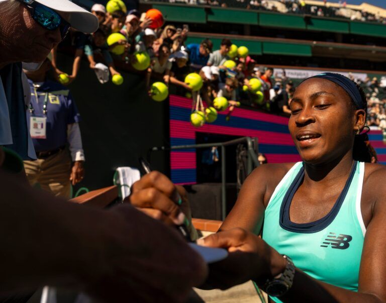 Coco Gauff signs autographs for fans after her third-round win over Maria Sakkari at the BNP Paribas Open in Indian Wells, Calif., Monday, March 10, 2025.