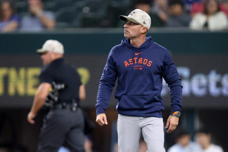 Houston Astros manager Joe Espada (19) leaves the field after being ejected during the third inning against the Texas Rangers at Globe Life Field.