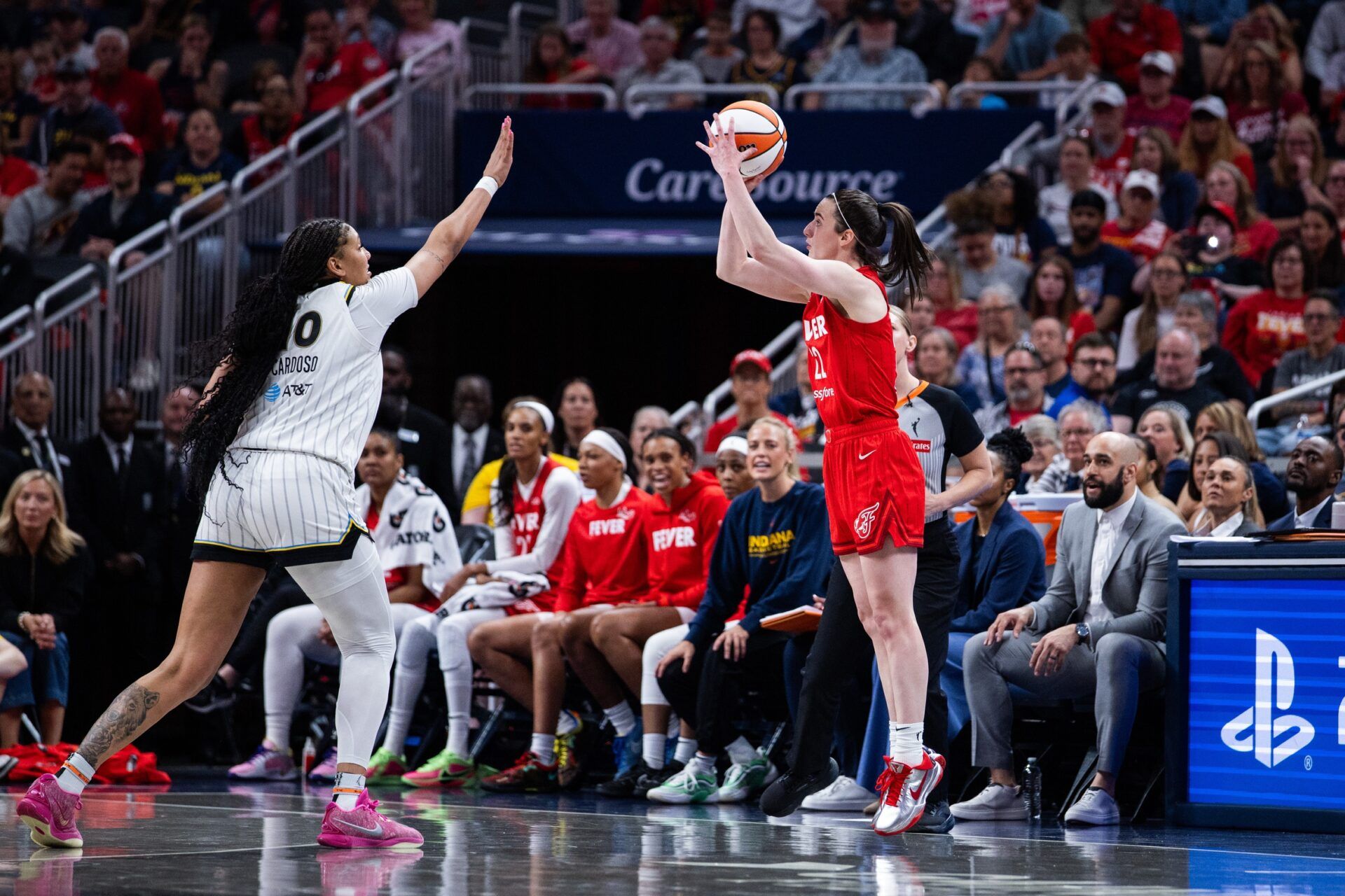 Indiana Fever guard Caitlin Clark (22)  shoots the ball while Chicago Sky center Kamilla Cardoso (10) defends in the second half at Gainbridge Fieldhouse.