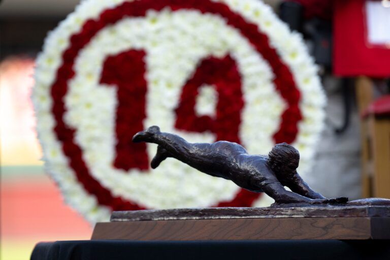 A miniture Pete Rose statue sits at a table George Foster at Great American Ball Park during the Cincinnati Red’s Pete Rose night at the ballpark on Wednesday, May 14, 2025 in Cincinnati.